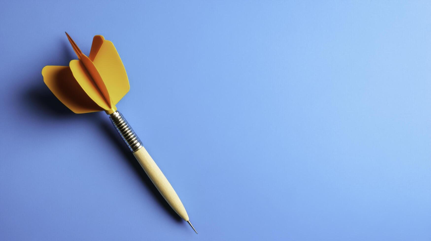 Colorful dart on a blue background for focus and goal-setting concepts photo