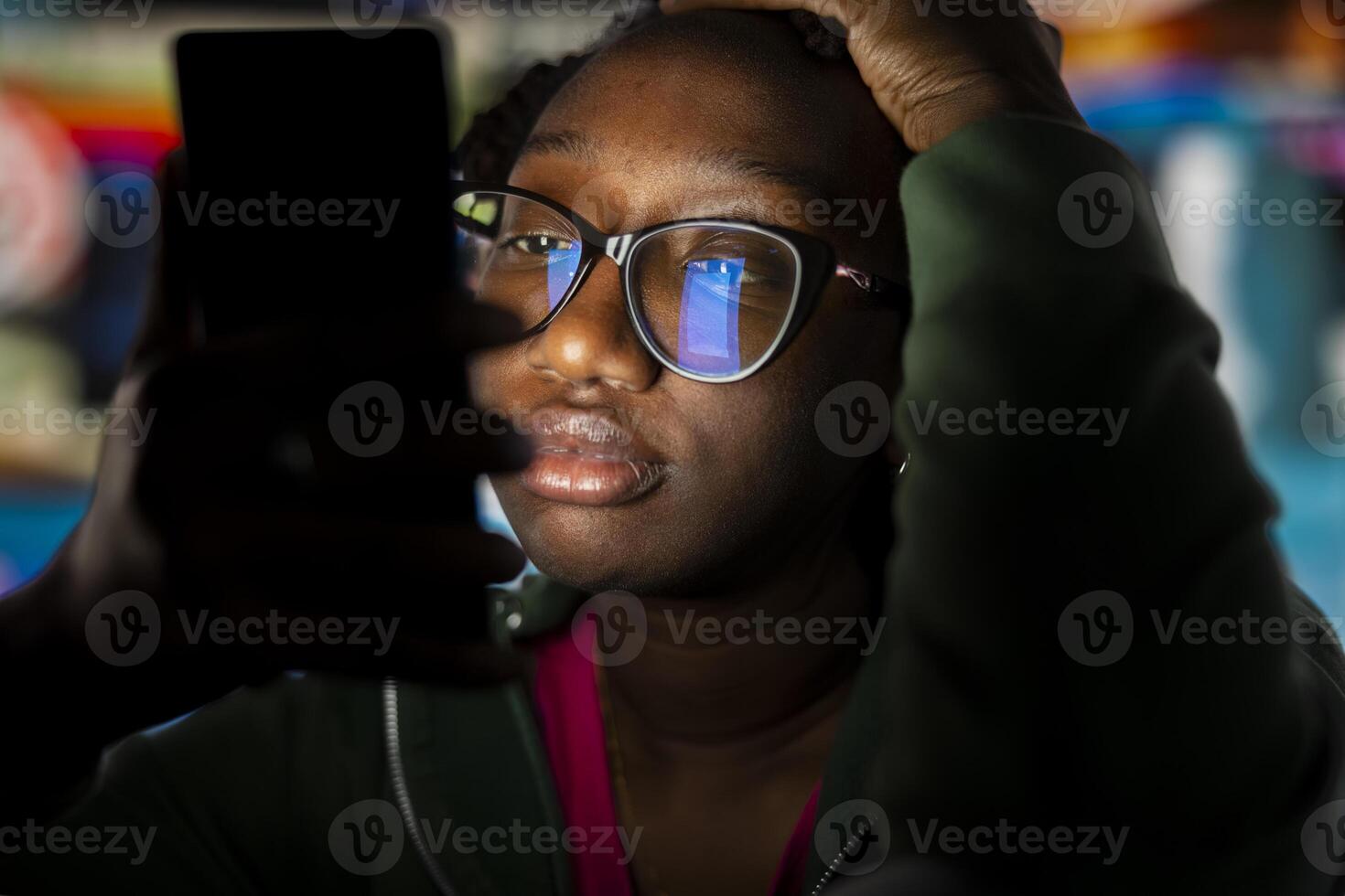 Closeup of bored woman glued to smartphone screen, enjoying leisure time with content on streaming services. Lazy person procrastinating with VOD broadcasts on phone in front of digital backdrop photo