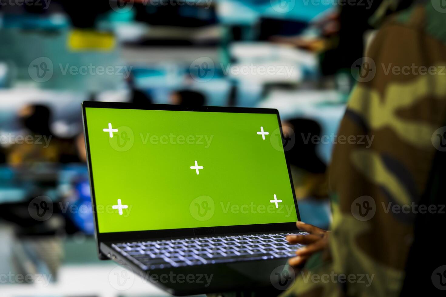 Close up of soldier in command center using green screen laptop, monitoring intelligence feeds. Armed forces expert oversees military operations in headquarters using mockup notebook photo