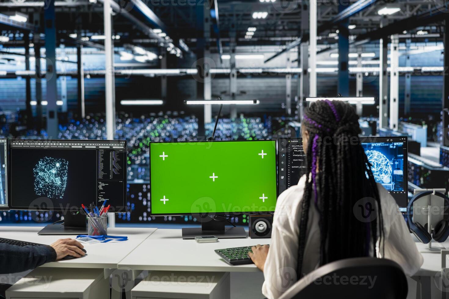 Engineer in data center using green screen computer, optimizing hardware for AI tasks, increasing workloads. Server hub IT worker automating system diagnostics using deep learning on mockup PC photo