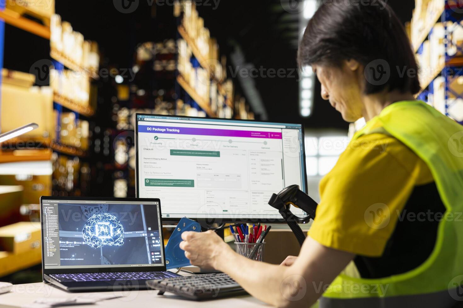 Asian warehouse worker uses AI virtual assistant to help manage inventory, scanning barcodes in order to update shipping labels and deliver accurate order processing. Online shopping activity. photo