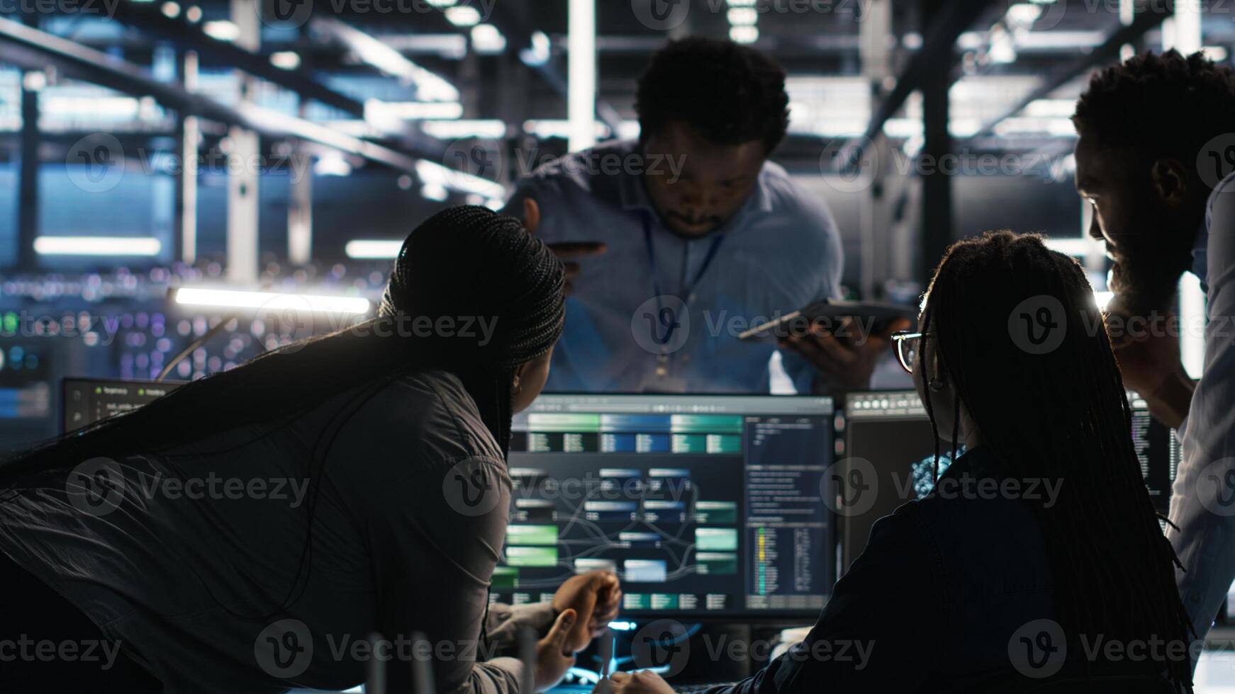 Data center teamworking programmers using node tree tool to identify infrastructure performance issues. Server hub colleagues working together reviewing data analysis graph photo