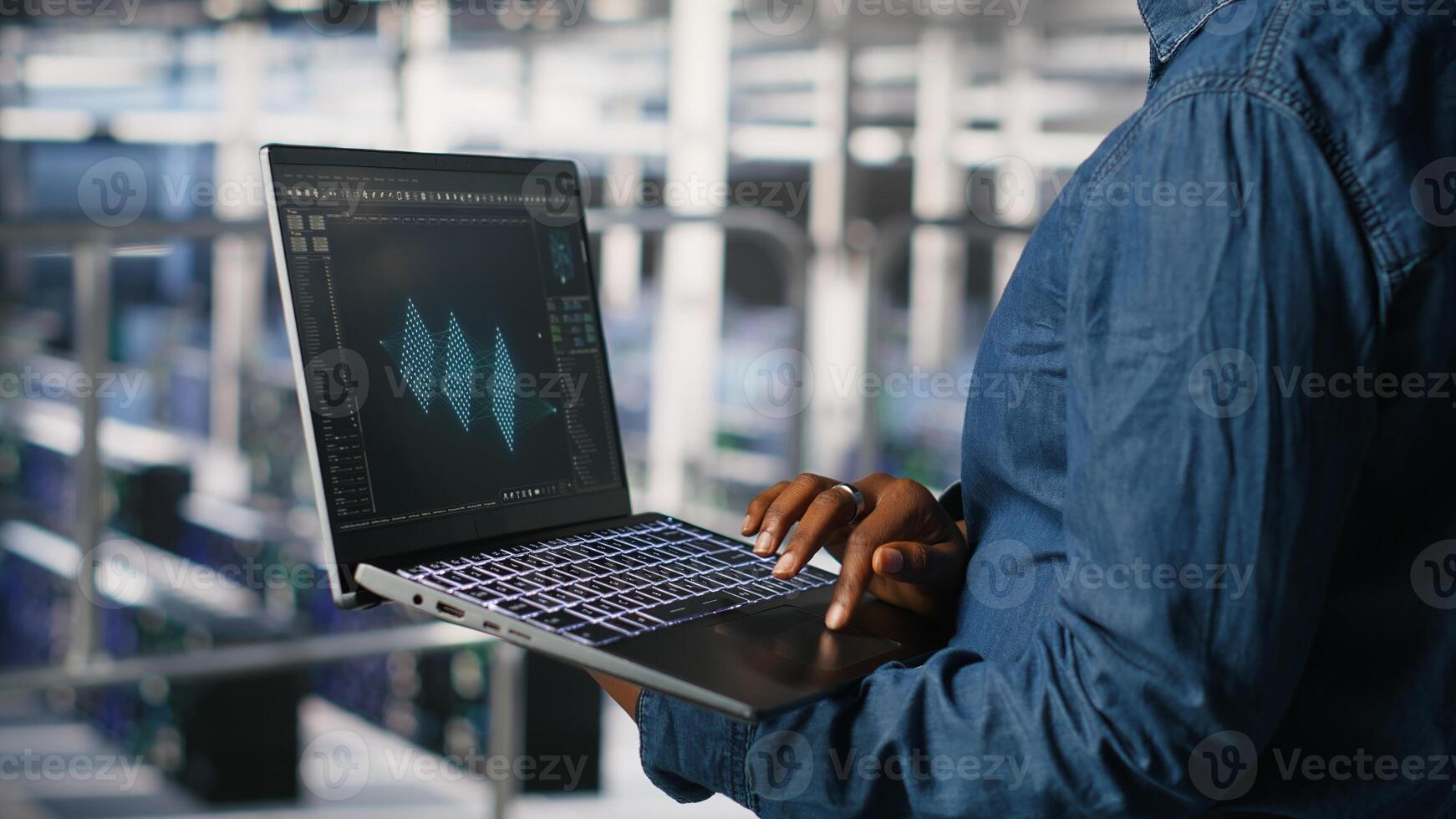 Close up of admin in data center using laptop to monitor neural network LLM visualization. Server hub IT expert overseeing rigs powering machine learning processes using notebook photo