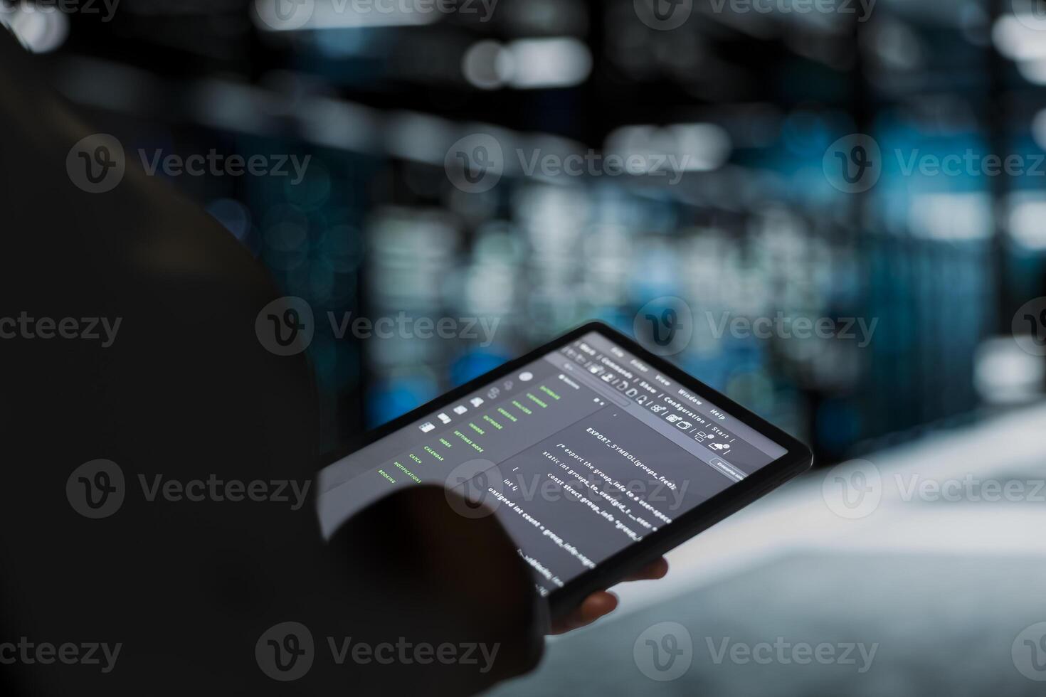 Close up of data center engineer using tablet to troubleshoot backend operations handling user requests. Server farm employee running software development tools on device, resolving system crashes photo