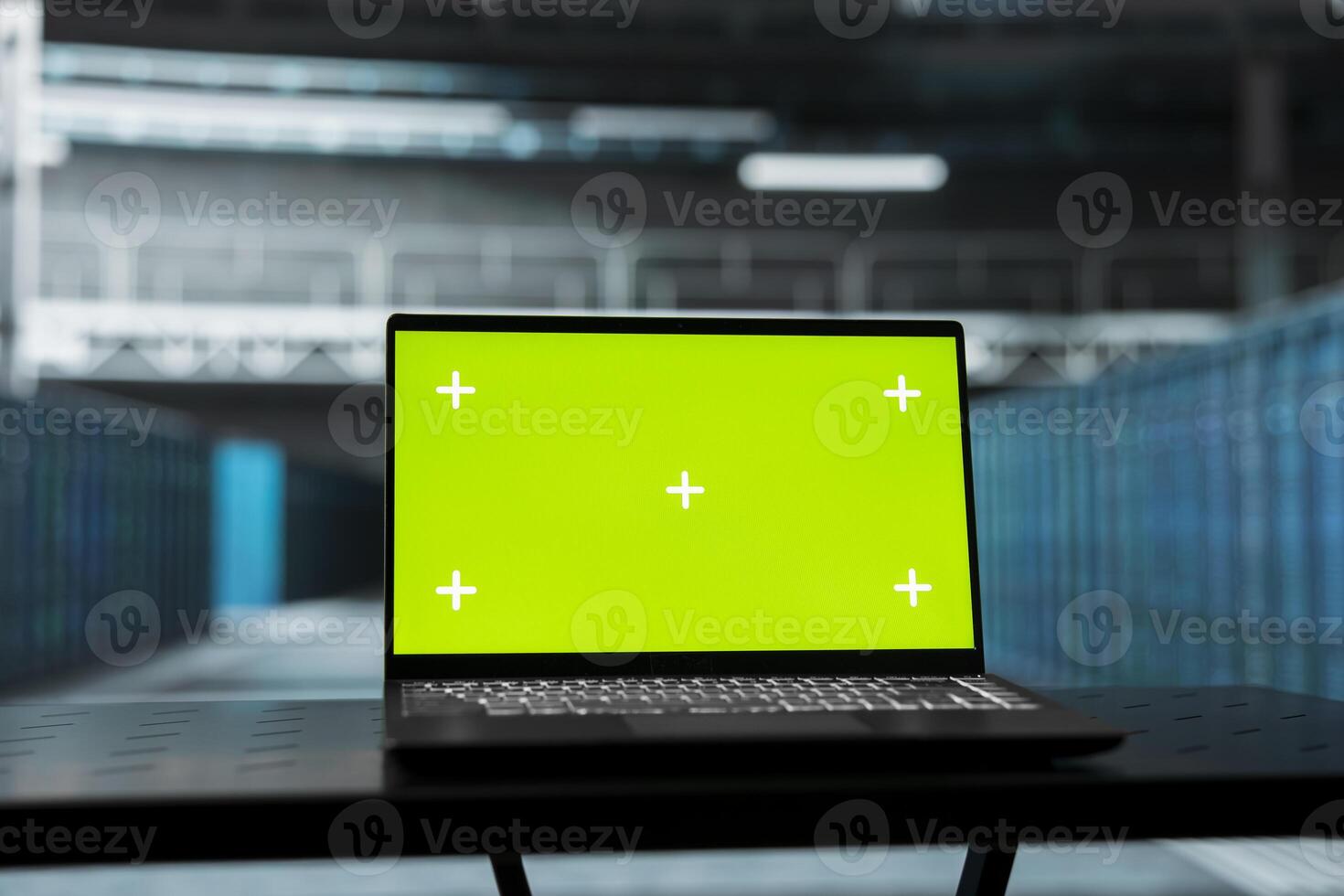 Green screen laptop overseeing data center equipment mainframes driving automation tasks. Chroma key notebook in server farm used to do backup of sensitive data of rigs storing company records photo