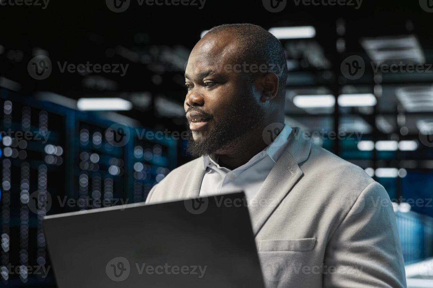Close up of data center admin using laptop, reading malfunctions logs, doing checkup to prolong hardware life span. Server hub workplace employee monitoring infrastructure rigs, troubleshooting issues photo
