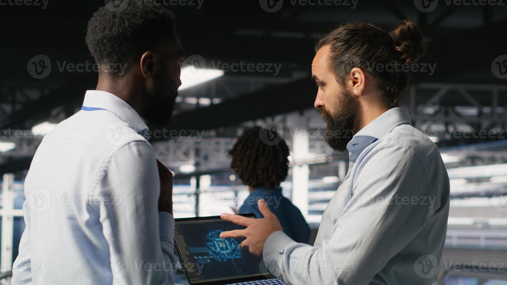 Server farm coworkers doing infrastructure AI machine learning automatization. Data center computer scientists collaborating to maintain servers using artificial intelligence photo