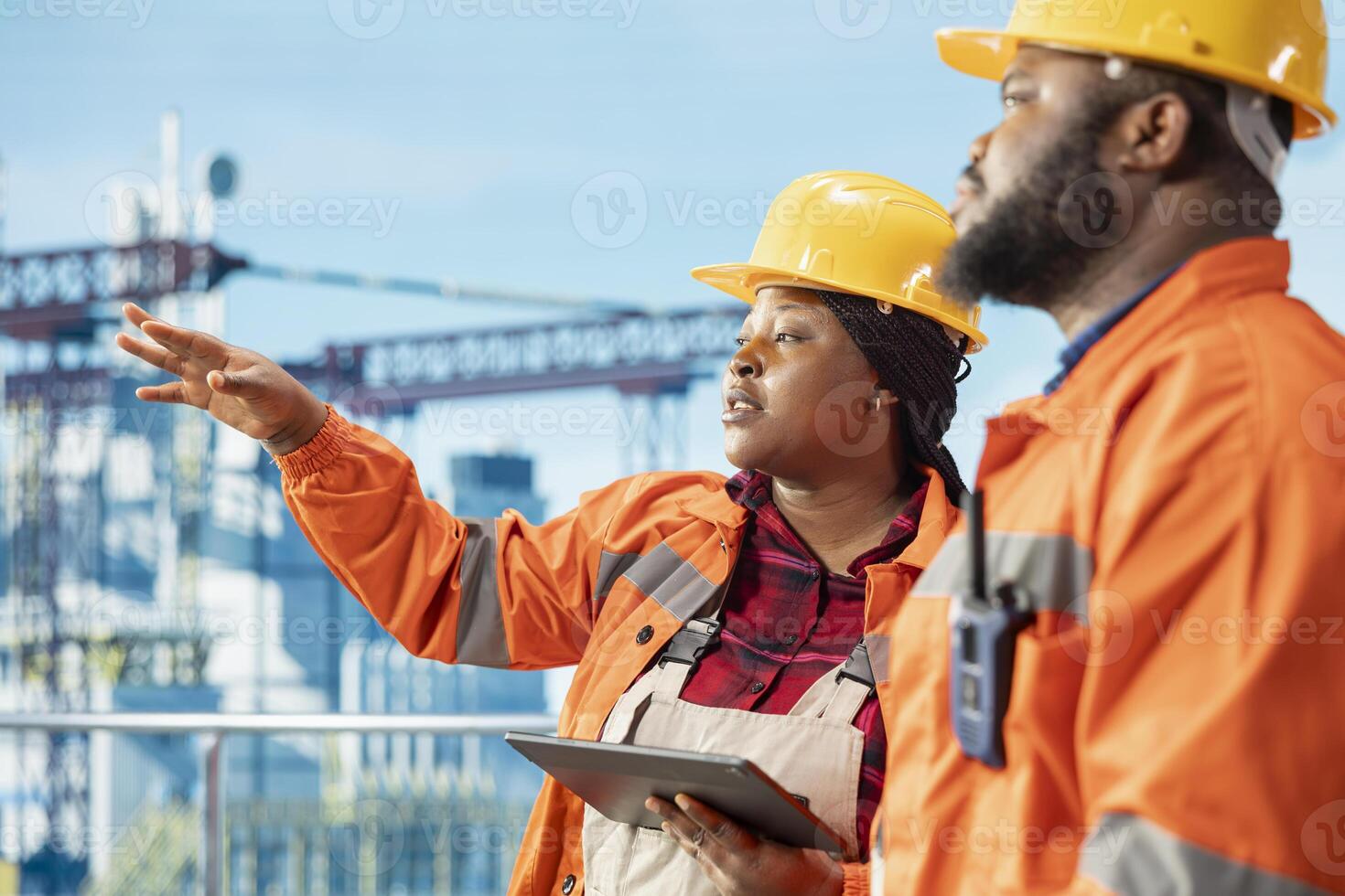 Offshore platform engineering team using monitoring program on tablet to track emissions, protecting environment. Teamworking colleagues conduct environmental risk assessment for drilling rig photo