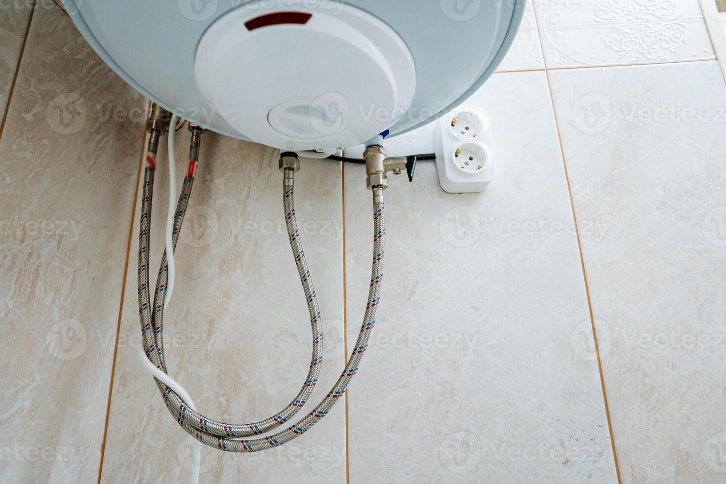 The process for Water Heater Installation involves the proper setup of Connection Hoses along with ensuring a Power Outlet is correctly positioned for functionality and safety during use photo