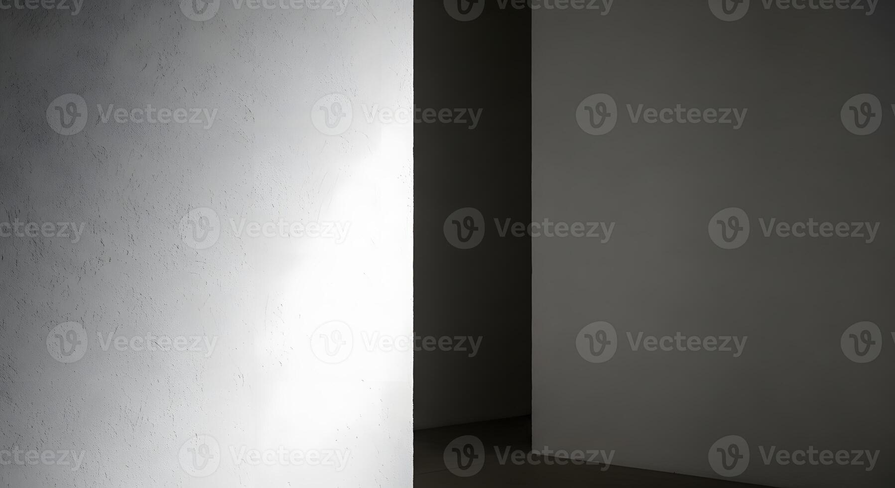 Abstract architectural composition of minimalist walls, defined by the strong interplay of light and shadow, creating depth and visual contrast within a contemporary interior photo