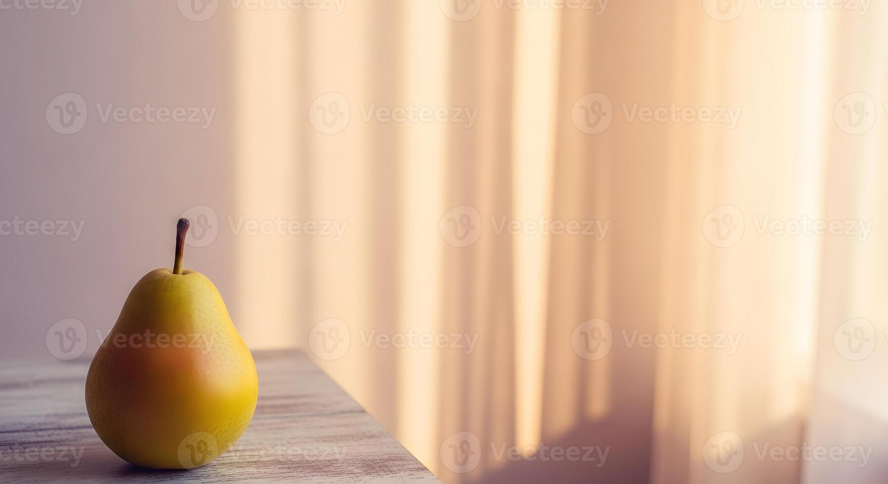 A single ripe yellow pear rests on a wooden surface with soft light filtering through a curtain in the background photo