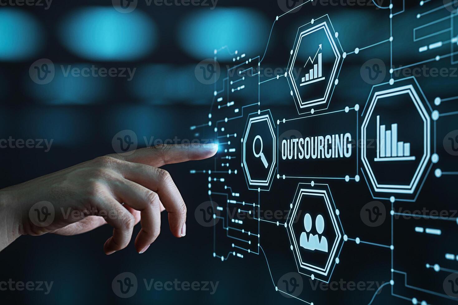Human hand interacting with a digital interface displaying outsourcing data analytics and team management icons in a futuristic hightech environment symbolizing innovation and business solutions photo