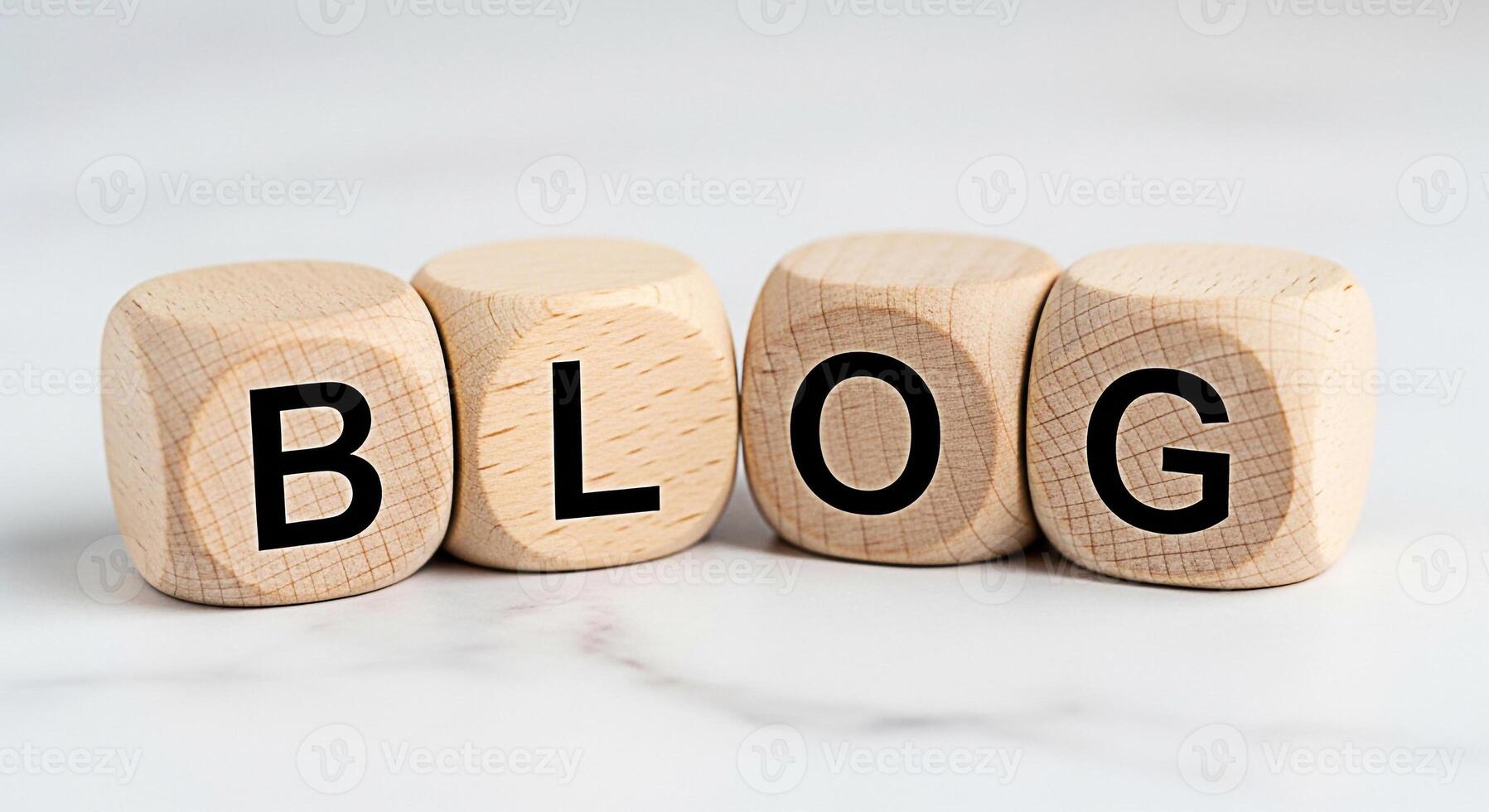 Wooden blocks spelling out BLOG on a white marble surface representing the concept of online content creation and digital marketing conveying a modern and informative mood for bloggers and content cre photo