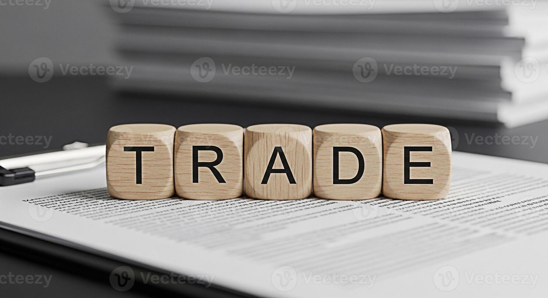 Wooden blocks spelling TRADE on a contract document in a professional setting symbolizing global commerce international business and the importance of fair agreements in a competitive and interconnect photo