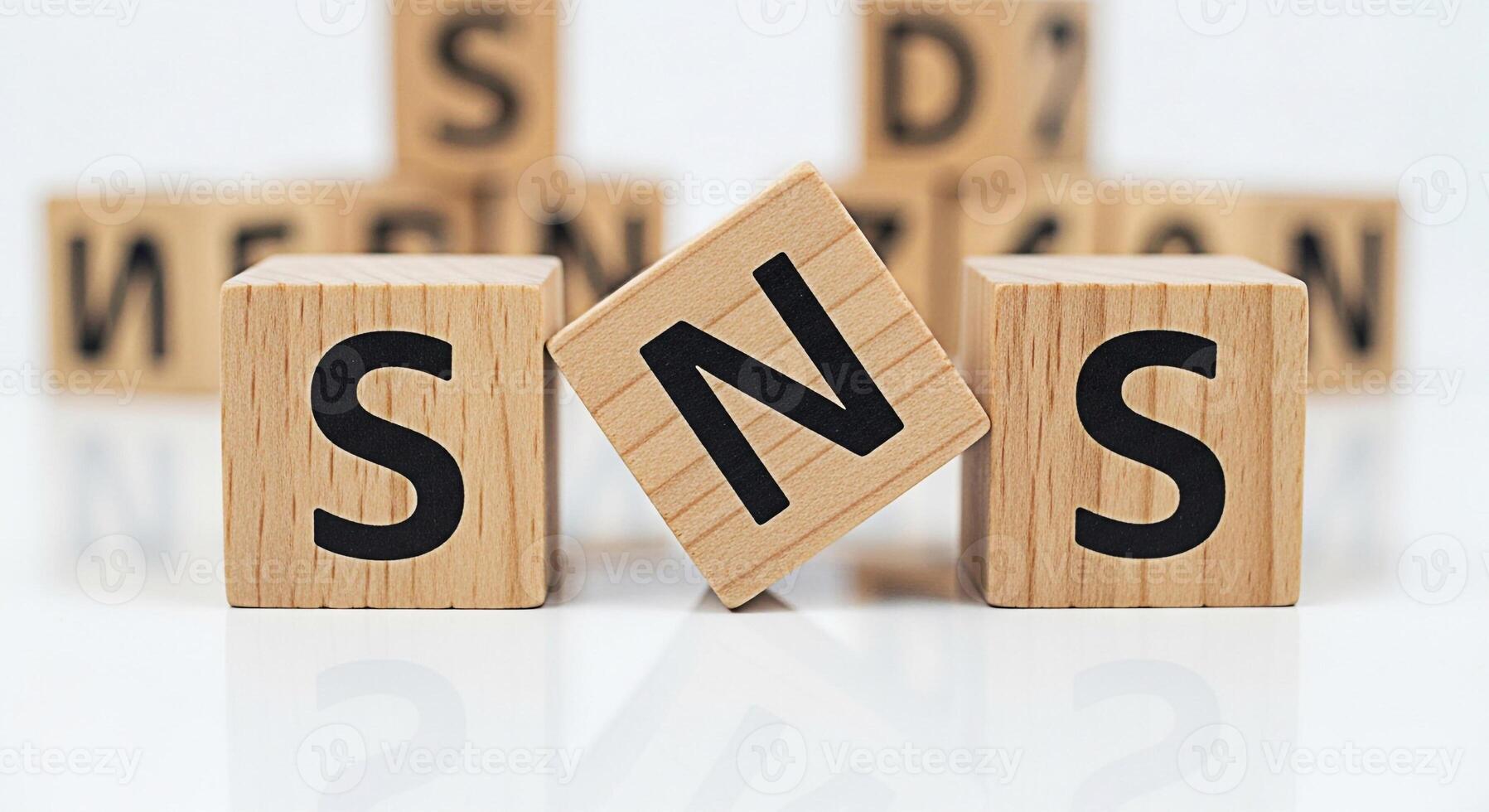Wooden blocks spelling SNS on a white surface symbolizing social networking services with a focus on connection and communication in a digital environment conveying a modern and minimalist aesthetic photo