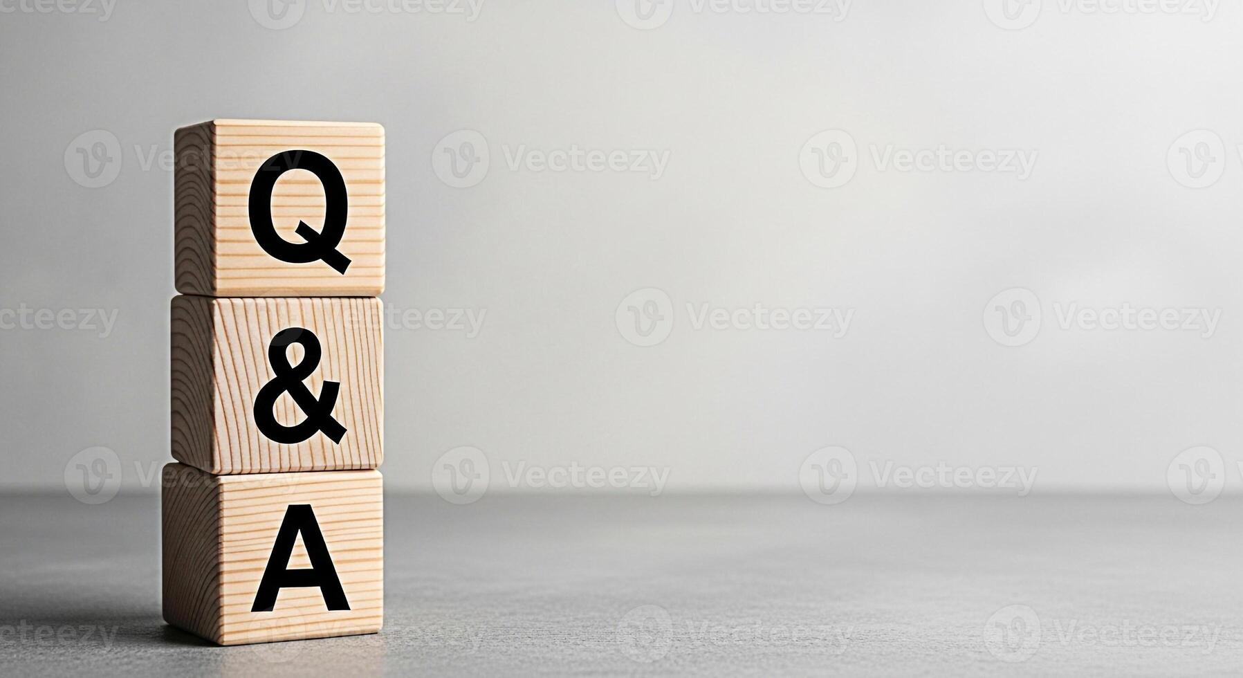 Wooden blocks displaying Q A in a neutral studio setting representing knowledge learning and problemsolving ideal for educational content business presentations and customer service materials conveyin photo
