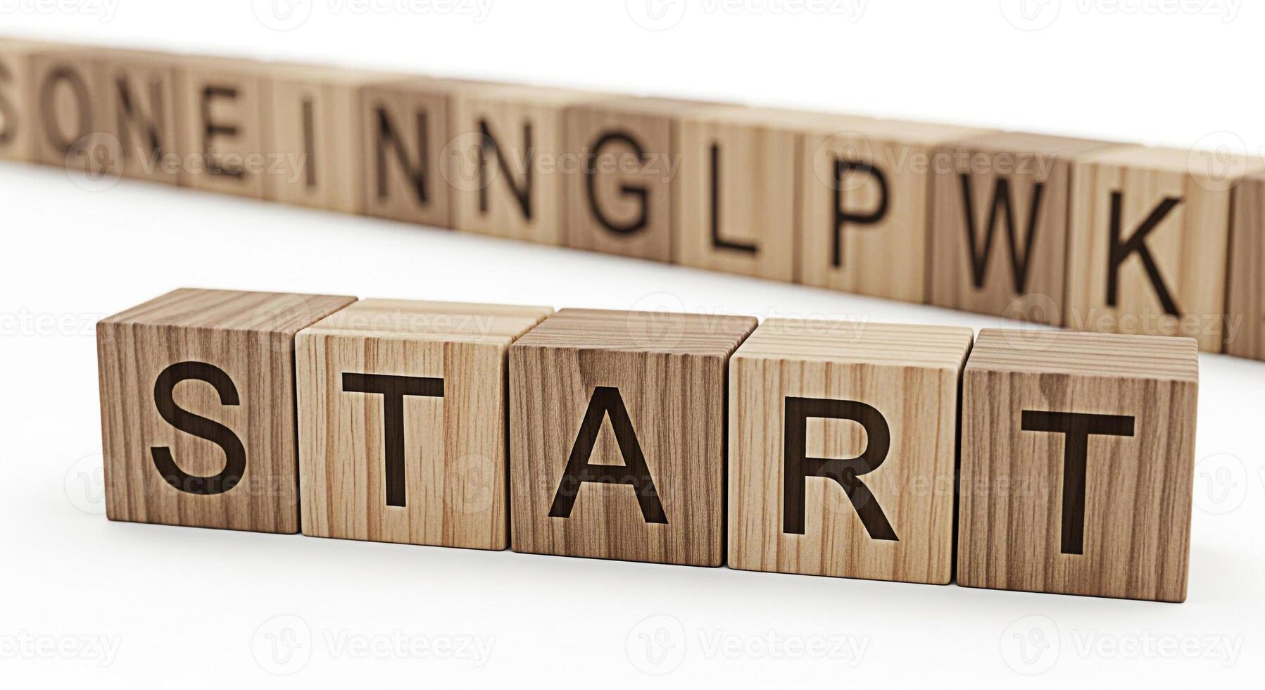 Wooden blocks spelling START on a white surface with other blocks in the background forming words symbolizing a fresh beginning and the initial steps towards achieving goals in a clean and minimalist photo