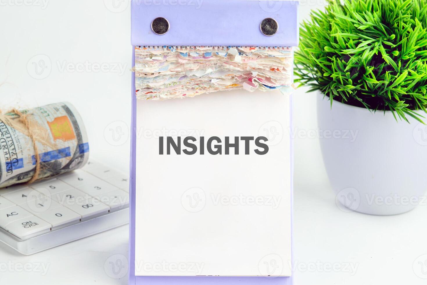 INSIGHTS written on a desktop calendar on a white background. Technology and data science concept. photo