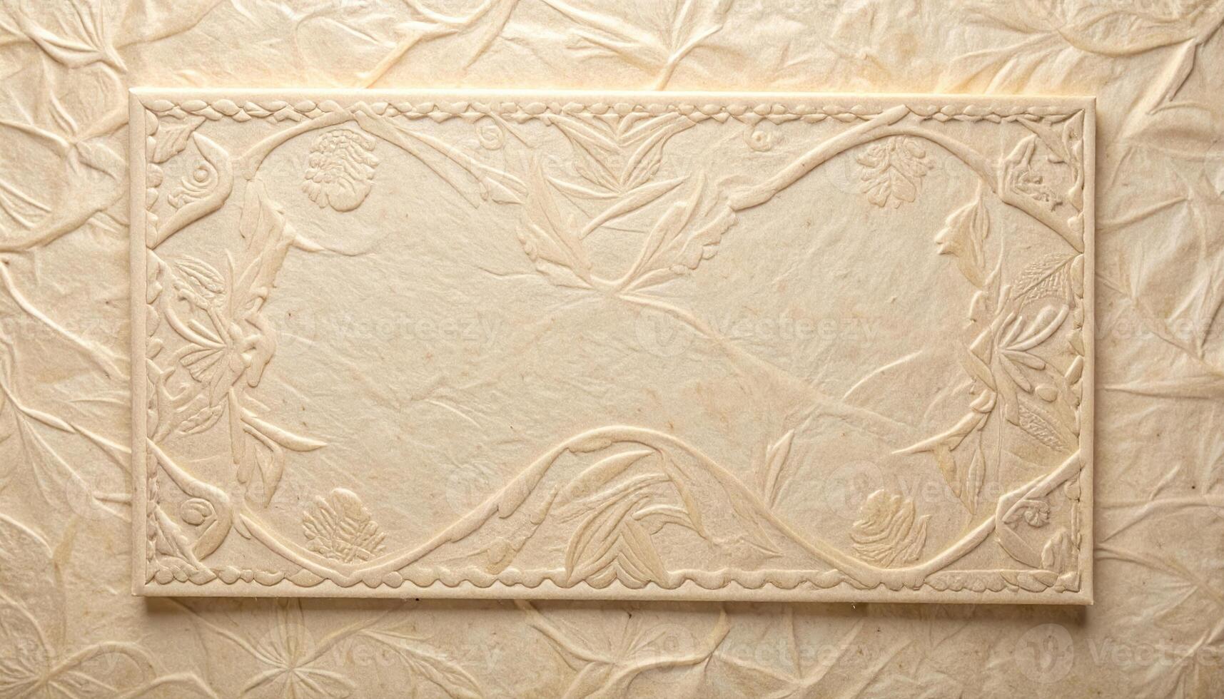 An embossed beige paper background with floral ornaments in a rectangular frame showcasing exquisite artistic paper making and delicate texture work. photo