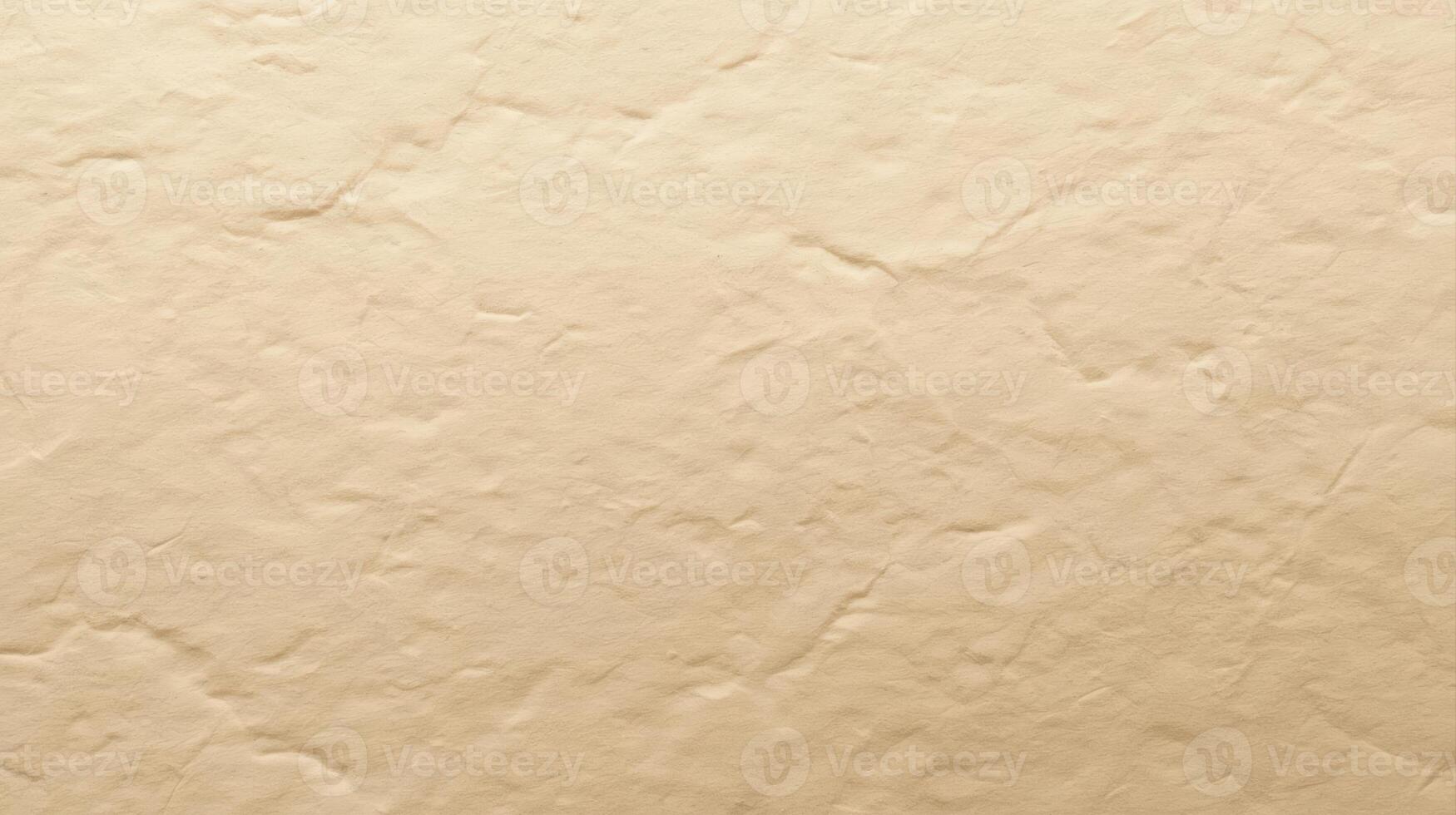 Close up of a textured beige surface reveals subtle cracks and variations in tone creating a warm and natural background effect. photo