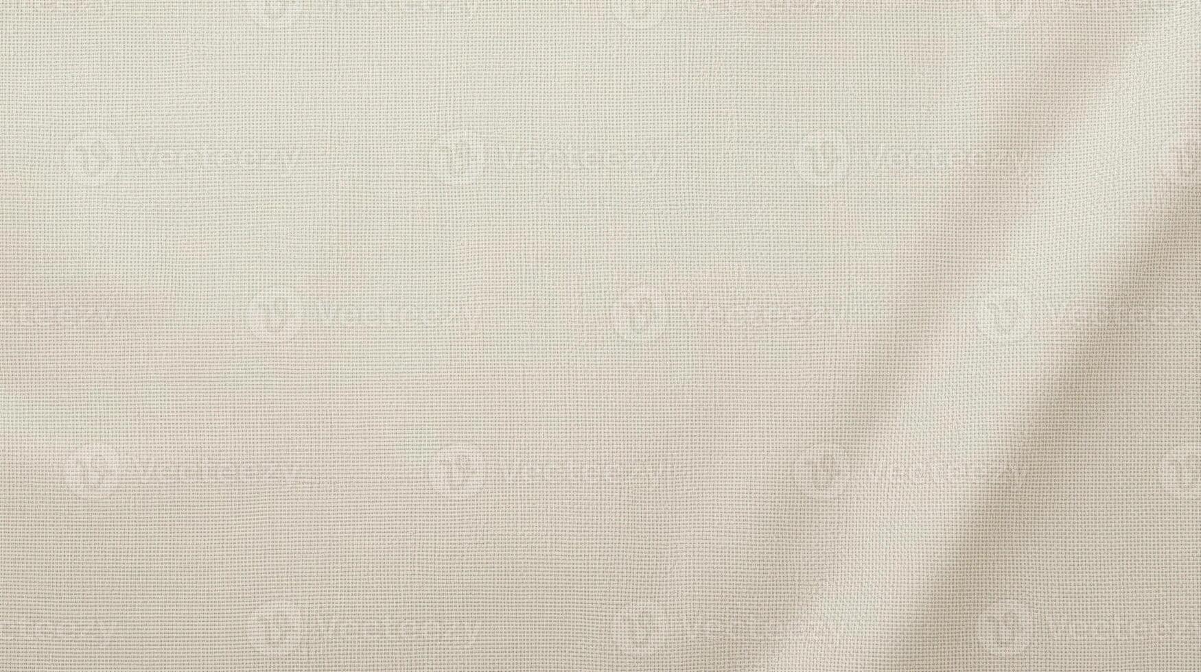 The soft, natural light illuminates the subtle texture and gentle folds of a cream-colored fabric, creating a smooth and elegant backdrop. photo