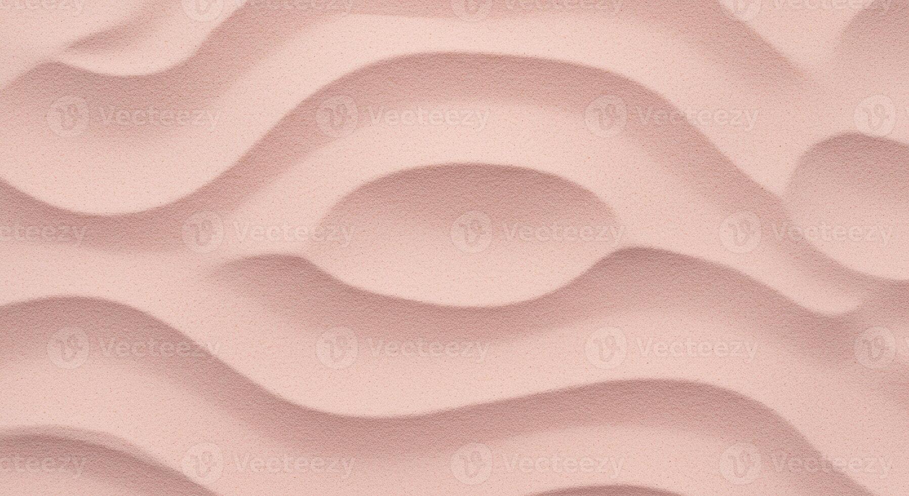 Gentle waves ripple across a solid blush colored surface creating an organic, textured background with subtle movement and soft light. photo