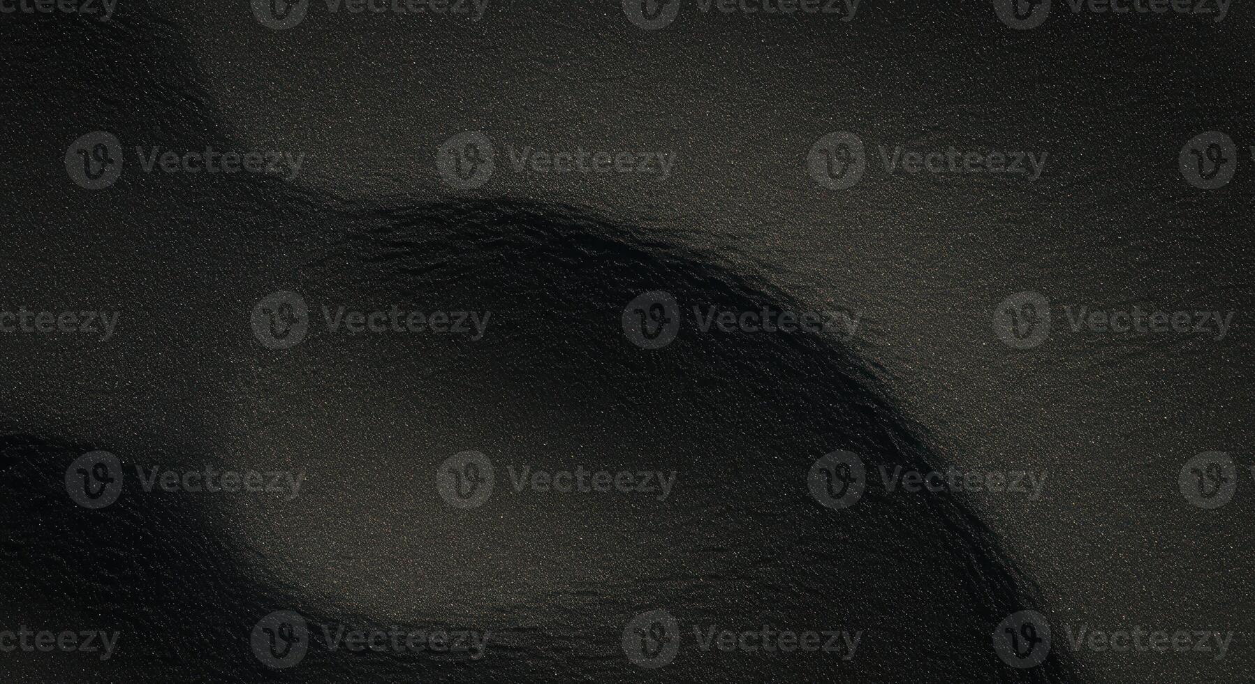 Dark waves undulate across a smooth, glossy surface creating abstract patterns in subtle gradients of black color and texture for backgrounds. photo