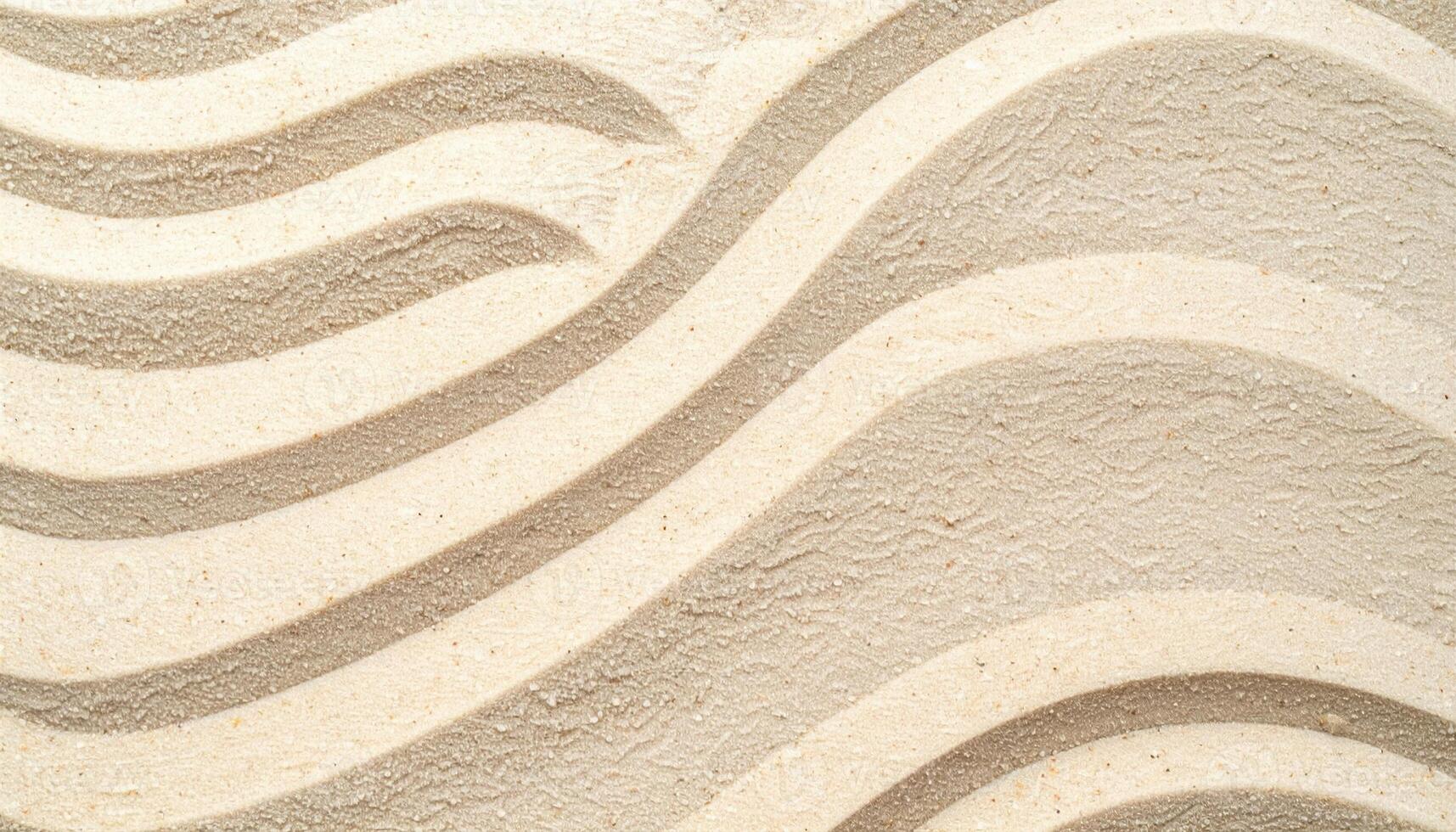 The textured surface of rippled sand shows a calming pattern of curves and lines creating a peaceful zen-like backdrop or environment. photo