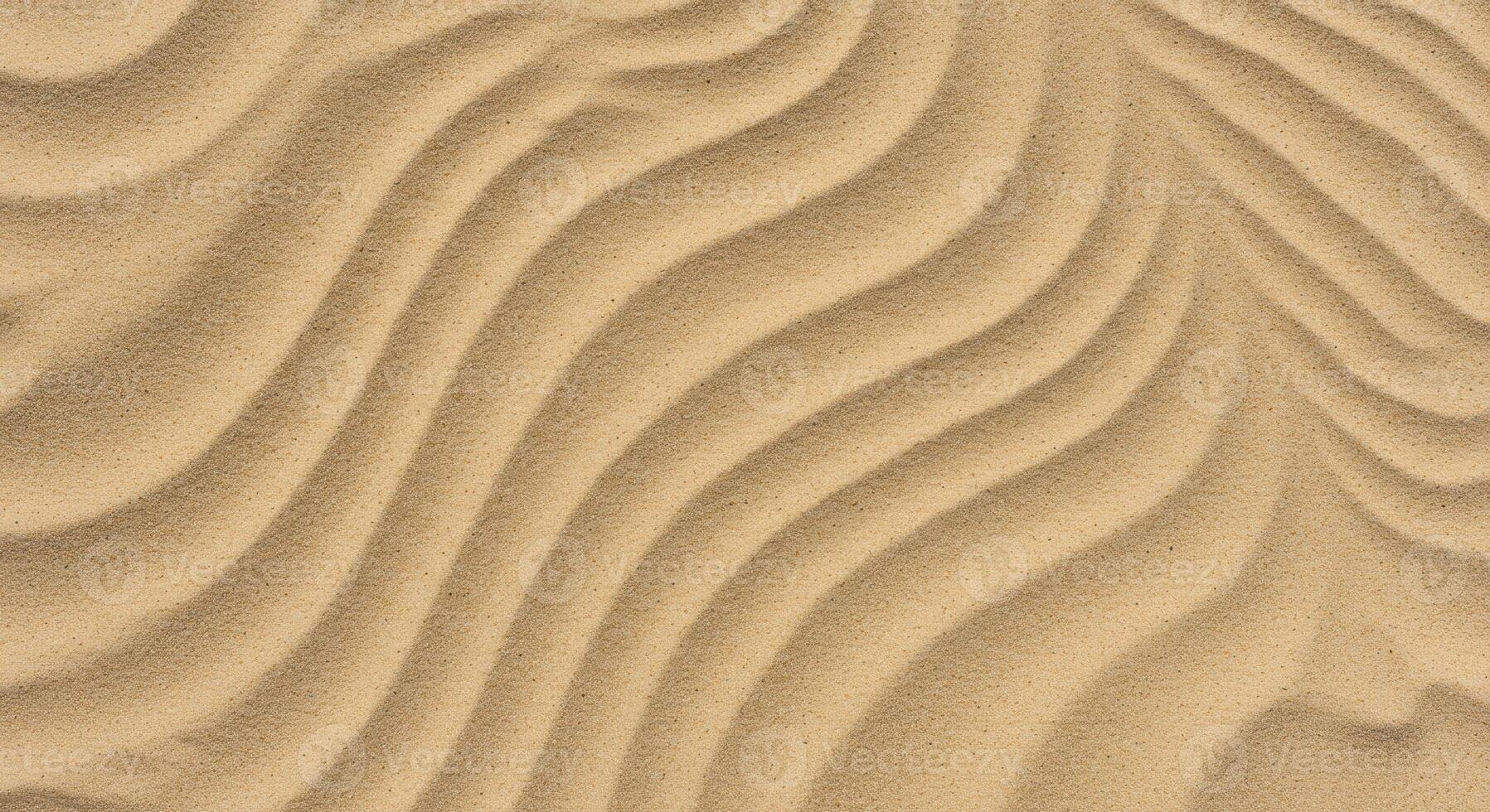 Close up of wavy sand patterns on a beach creates a stunning abstract image evoking tranquility and the rhythmic power of nature itself. photo