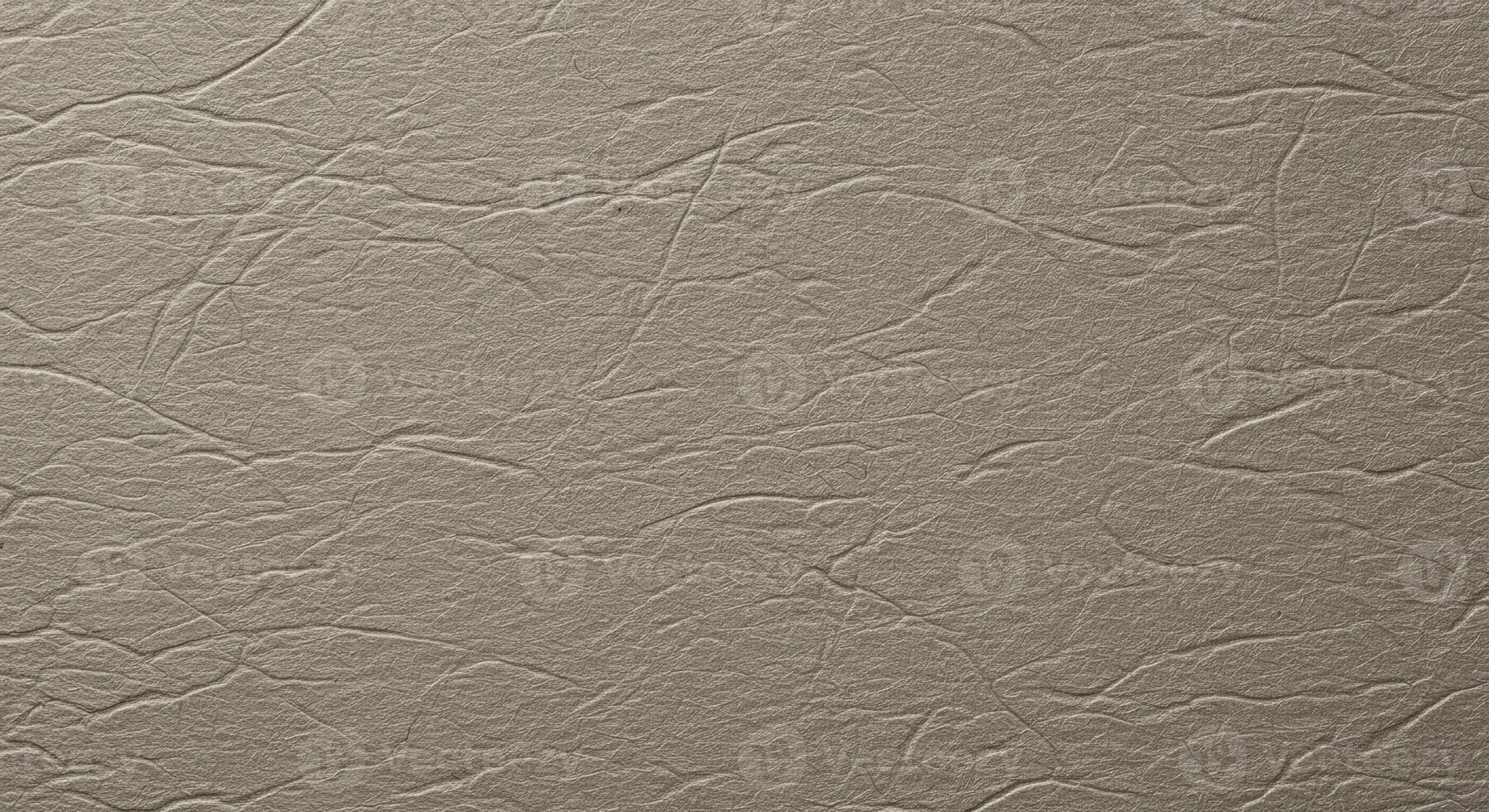 The intricate patterns of wrinkled beige paper create an abstract textured background that is ideal for graphic design and artistic projects. photo
