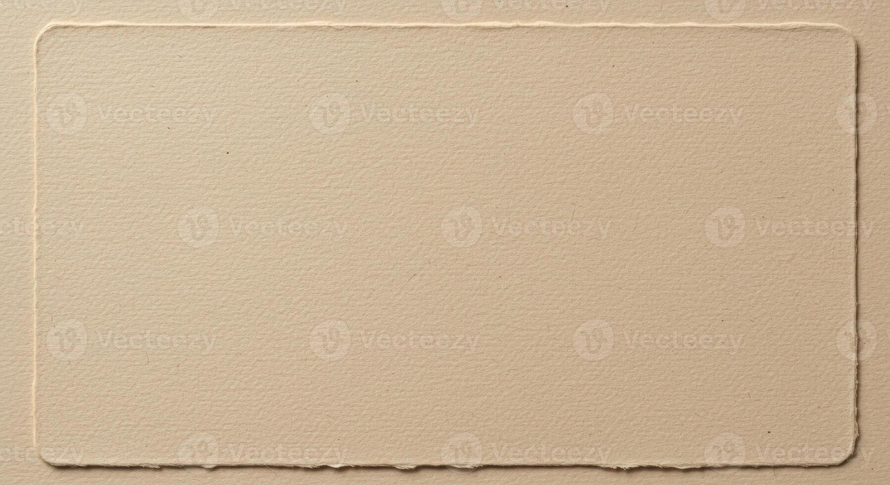 A textured rectangular shape with deckle edges on a flat background creates an elegant space ideal for displaying unique designs and artworks. photo