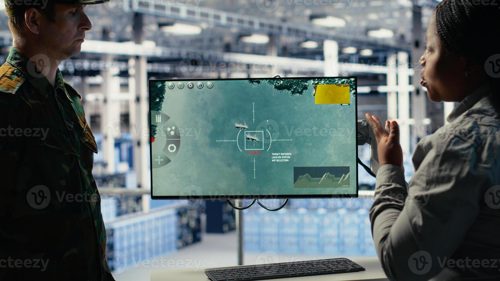 Military data center coworkers looking at radar software on screen to watch for enemy threats. Team of army employees in data center scans suspicious activity to detect dangers, camera B photo