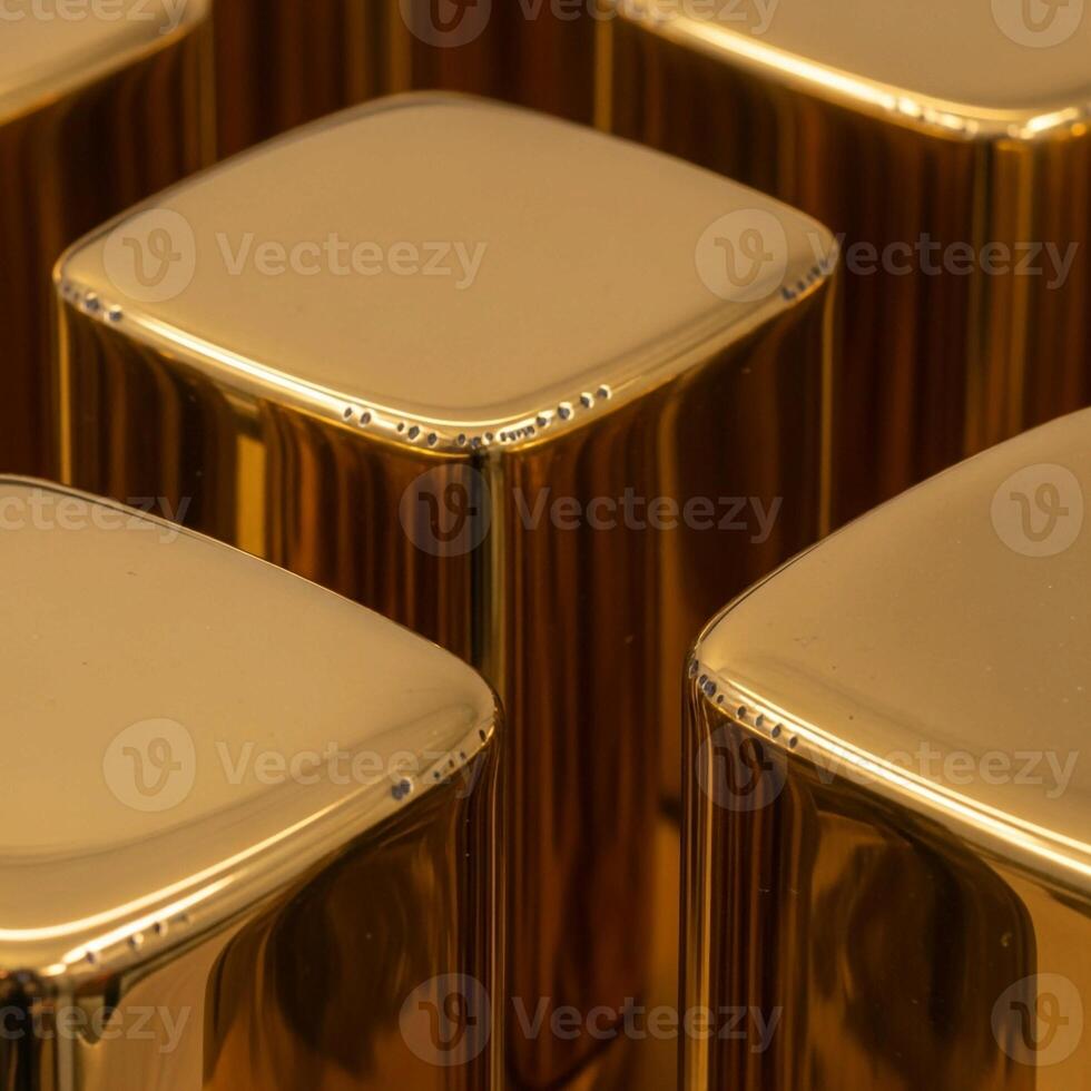 Close up abstract view of polished golden square topped pillars reflecting warm light in a repeating pattern photo
