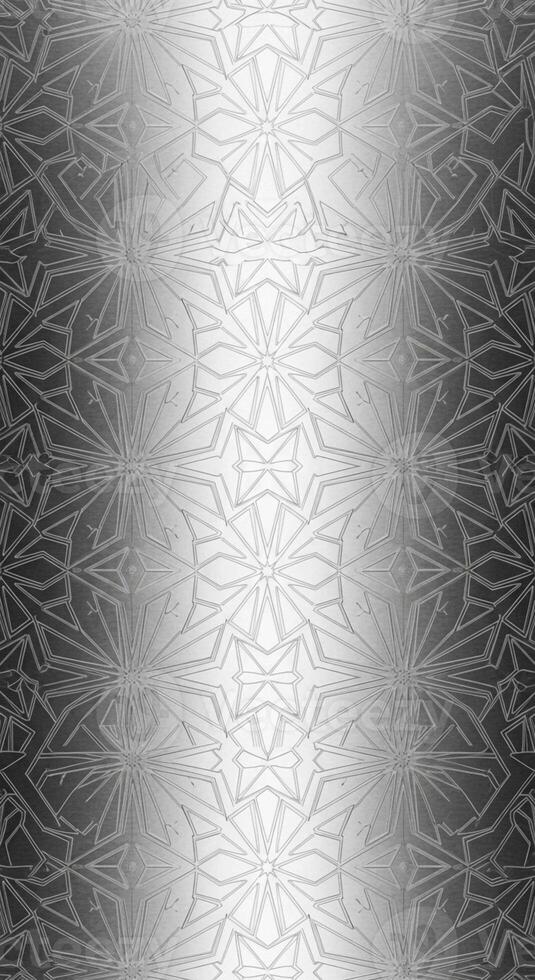 Intricate silver metallic texture with a repeating symmetrical pattern and subtle gradient effect photo