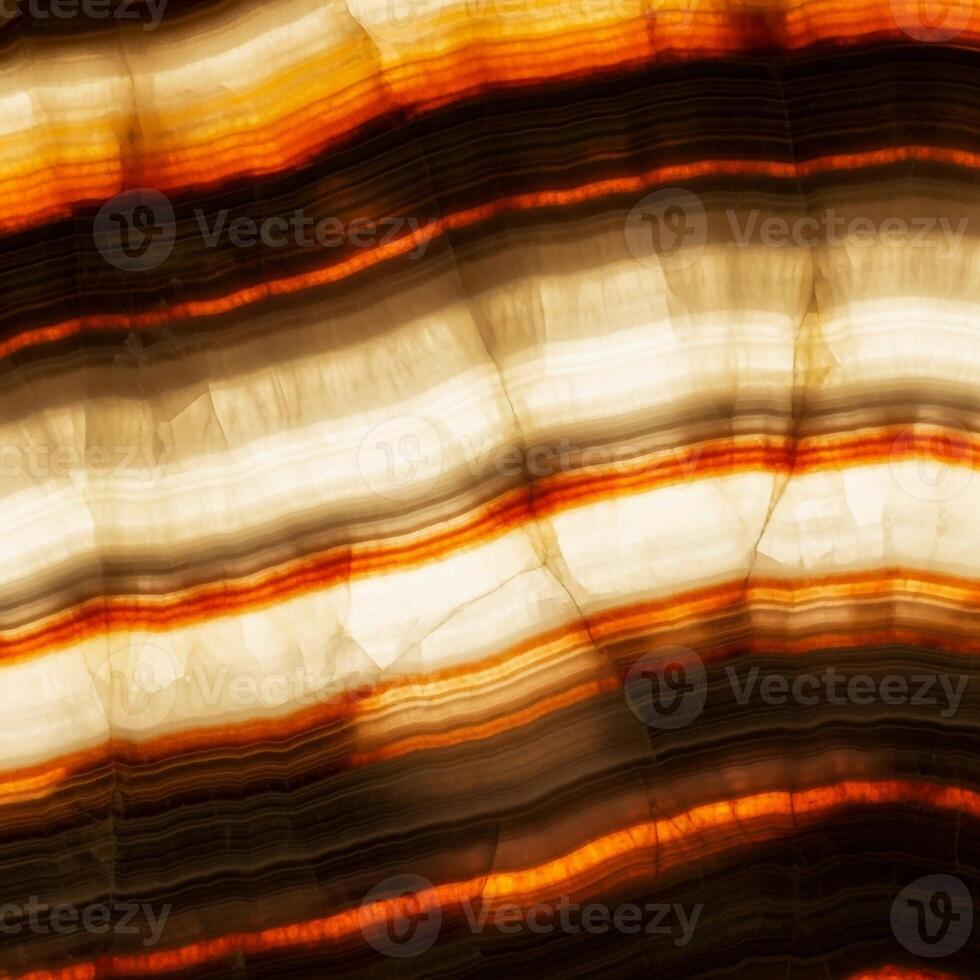 Abstract macro photograph captures the warm glowing layers of translucent onyx stone illuminated from within photo