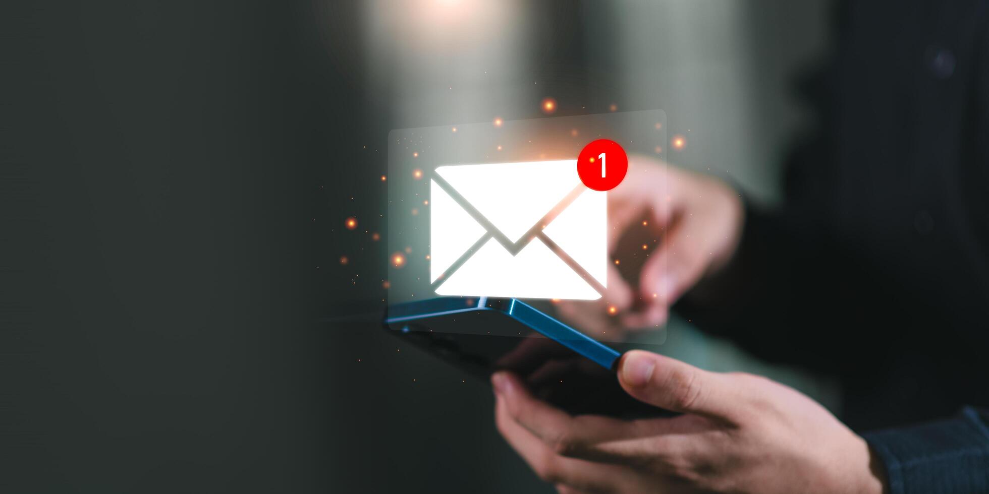 A person checking a smartphone with a glowing new email notification icon, representing digital communication, email marketing, online messaging, and business connection technology. photo