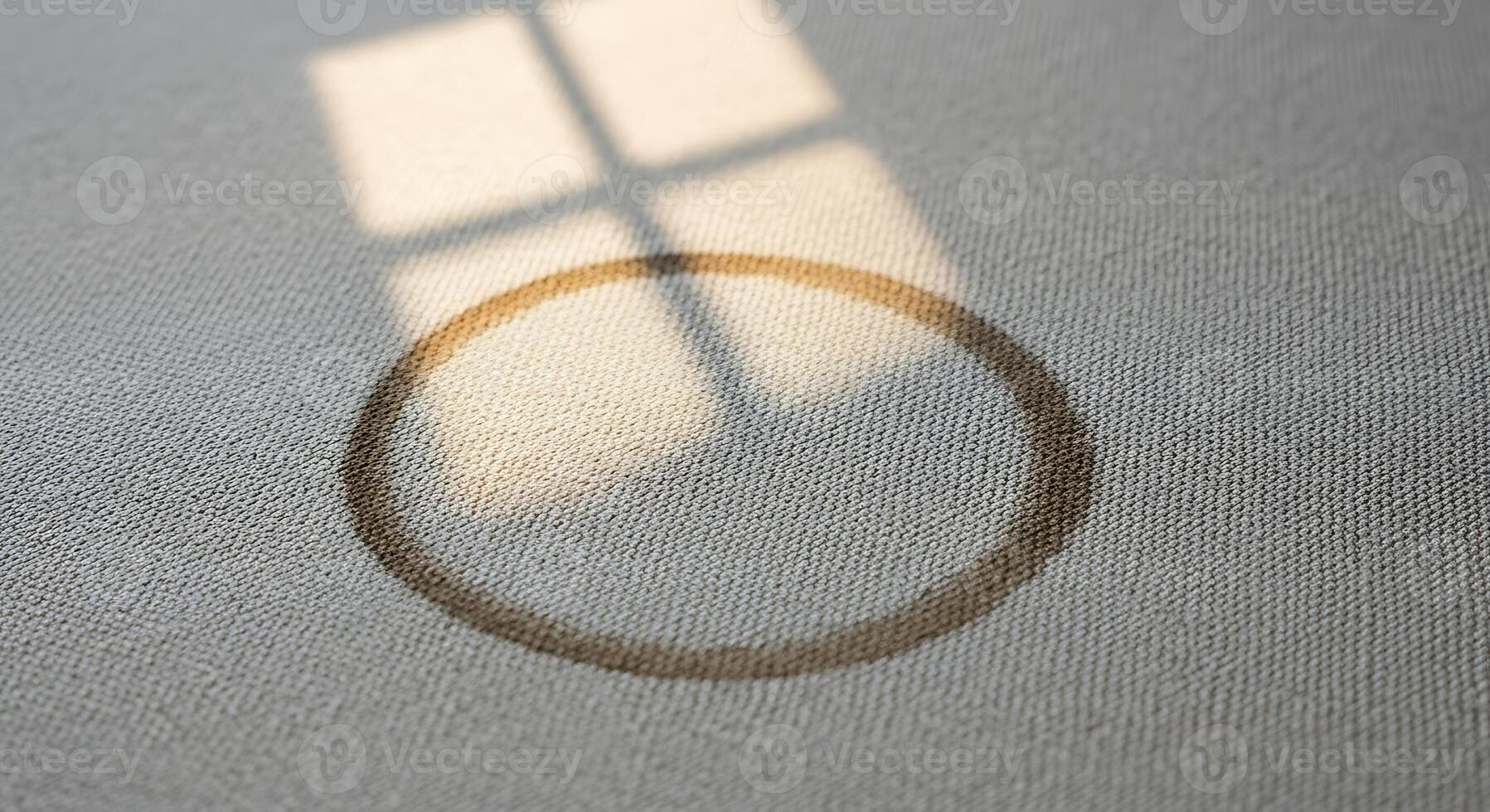 Sunlight Casting Shadow of Window Frame and Circular Object on Light Textured Surface photo