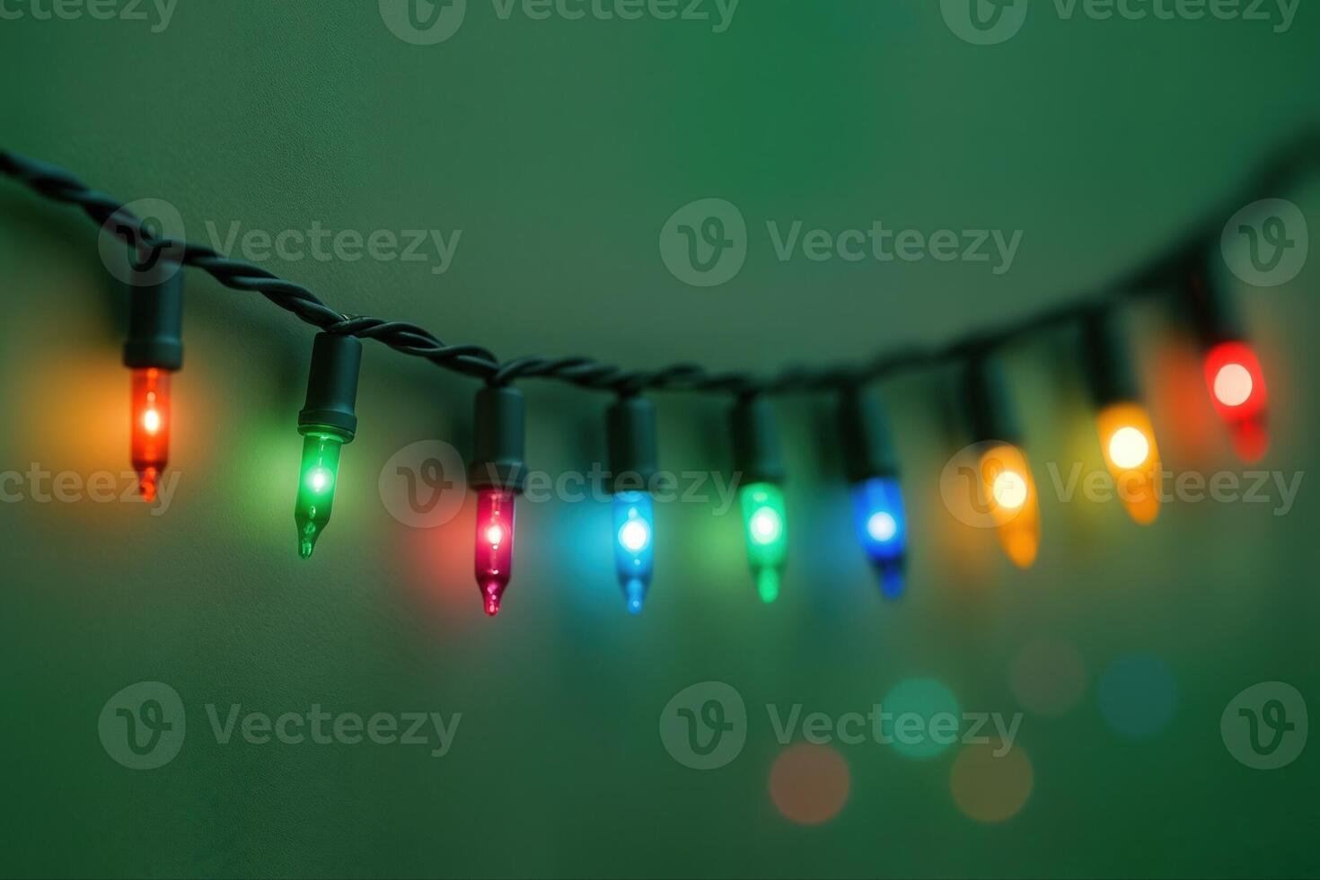 Christmas Lights String Hanging Indoors With Colorful Bulbs Creating A Festive Atmosphere During The Holiday Season With Shallow Depth Of Field photo