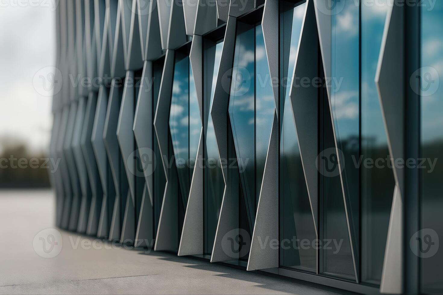 Modern Architectural Facade With Serrated Panels Reflecting Sky And Clouds On A Sunny Day With A Minimalist Perspective Emphasizing Geometric Patterns photo