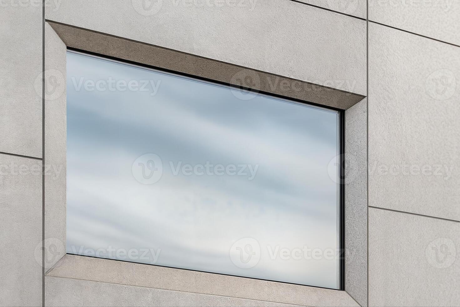 Building Facade Featuring a Large Glass Window Reflecting Clouds in a Modern Architectural Style During Daytime with Minimalist Design Features photo