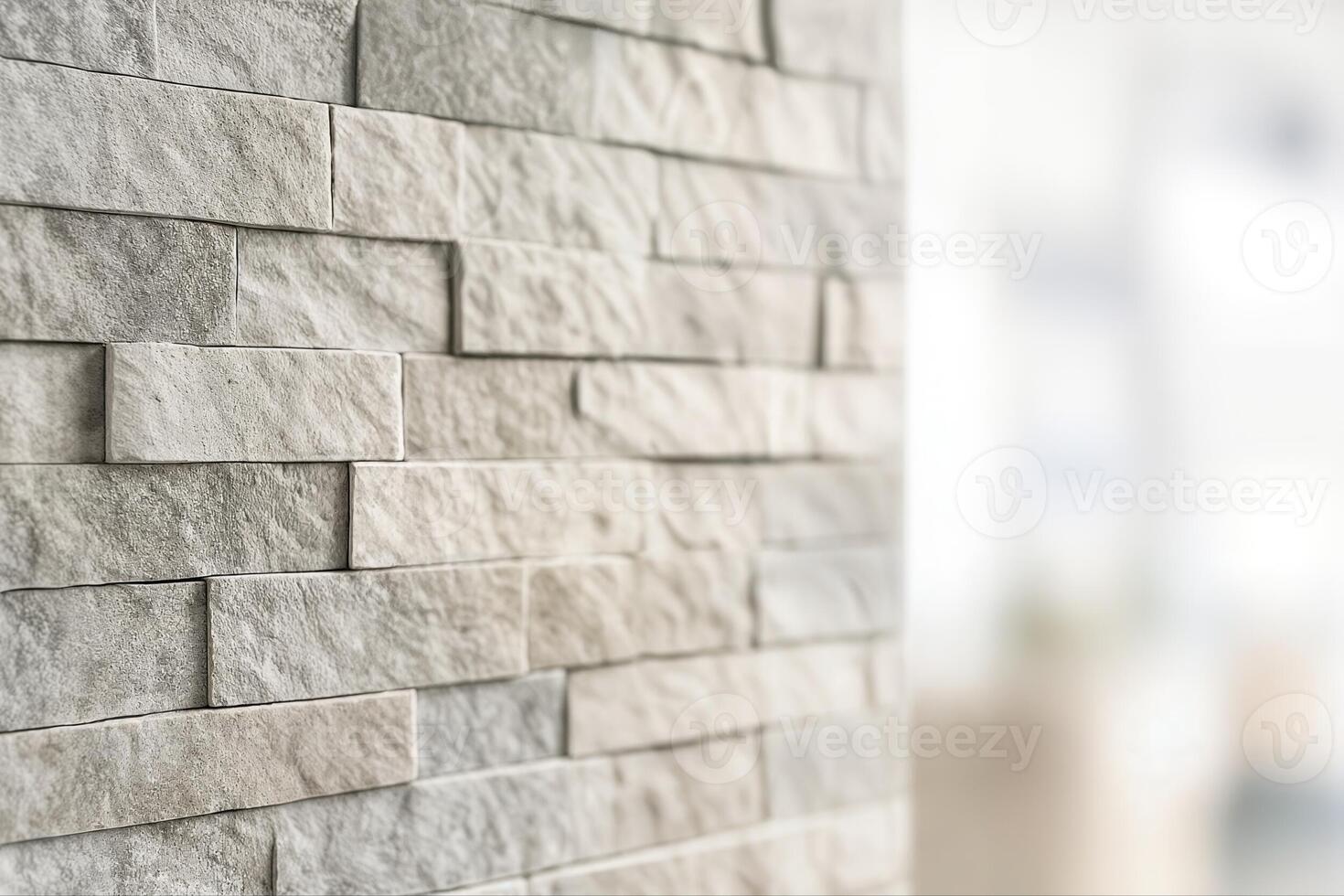Textured Stone Wall In A Modern Interior Featuring A Closeup View Of Interlocking Stone Pattern With Natural Light Creating A Subtle And Neutral Atmosphere photo