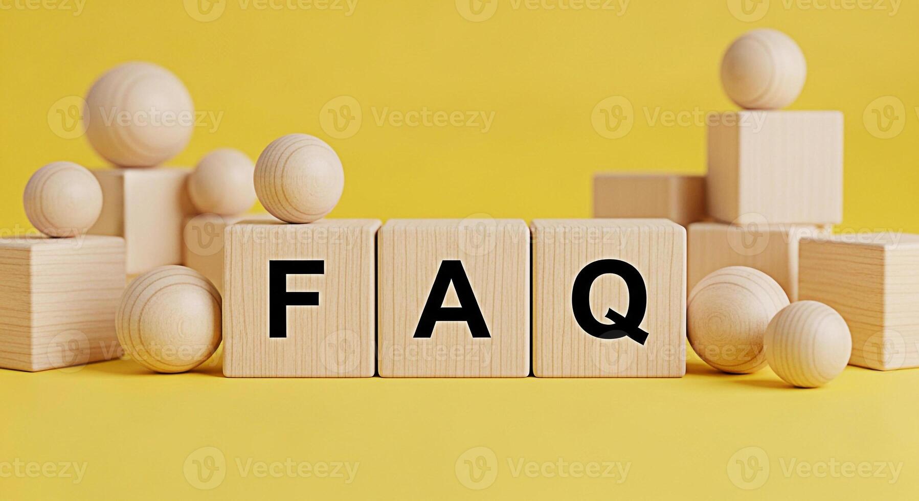 Wooden blocks displaying FAQ on a bright yellow background symbolizing information access and customer support creating a sense of clarity and helpfulness in addressing common questions and concerns photo