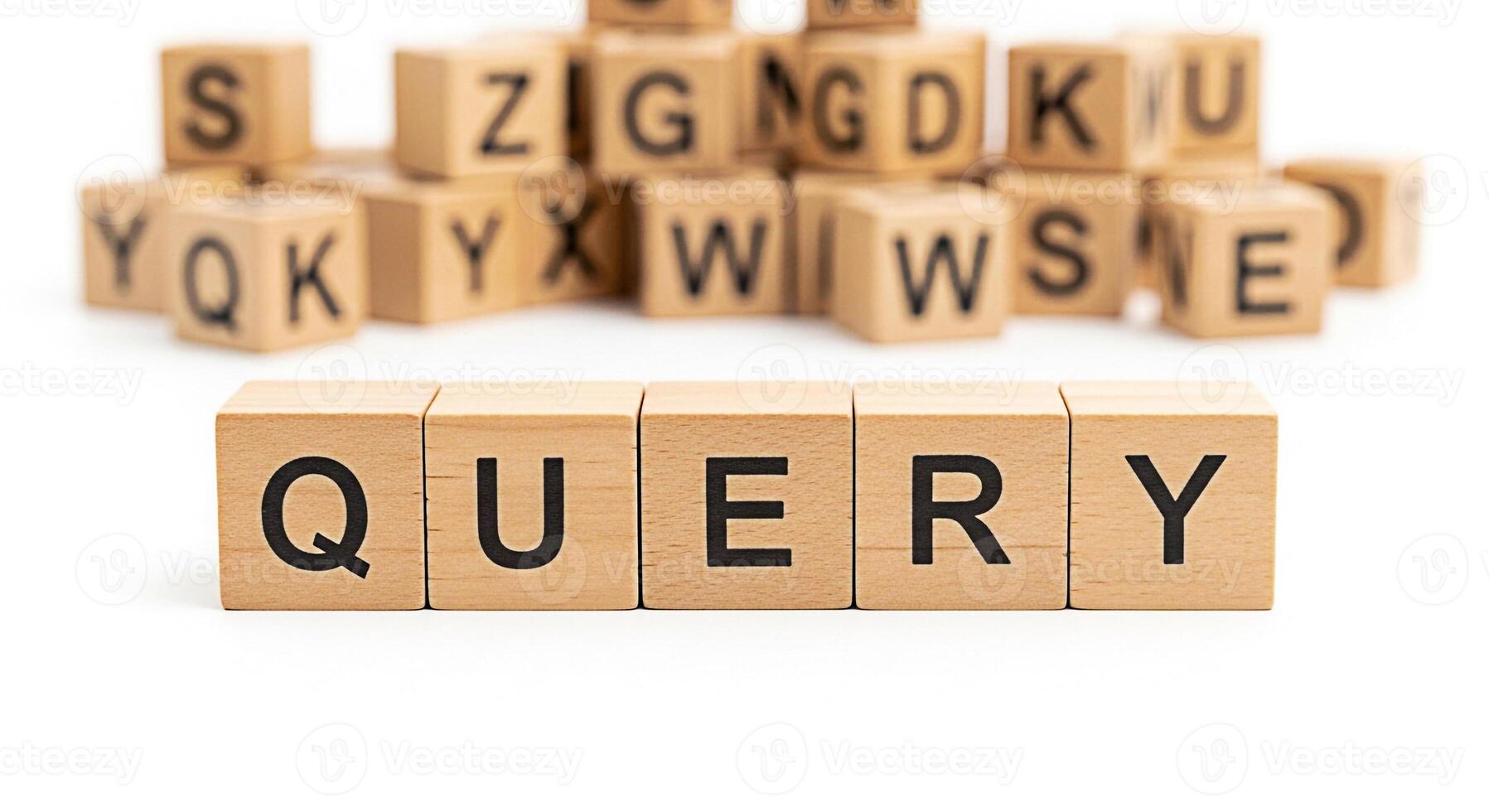 Wooden blocks spelling QUERY on a white surface surrounded by other letter blocks representing information retrieval and search engine optimization in a clean and minimalist setting conveying precisio photo