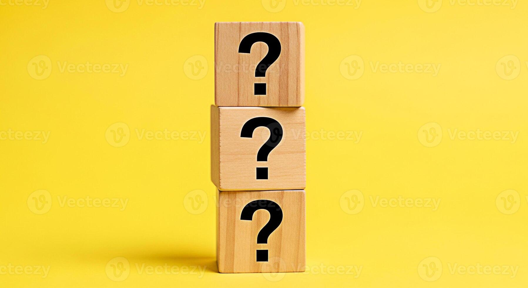 Stacked wooden blocks displaying question marks against a vibrant yellow backdrop symbolizing uncertainty inquiry and the search for answers in a bright and engaging visual concept photo