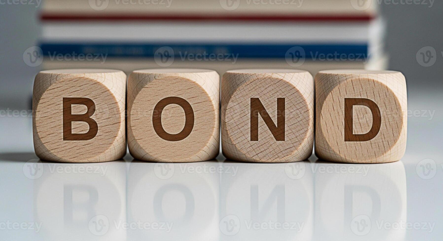 Wooden blocks spelling BOND on a reflective surface conveying financial security and investment opportunities in a stable and trustworthy environment with books in the background symbolizing knowledge photo