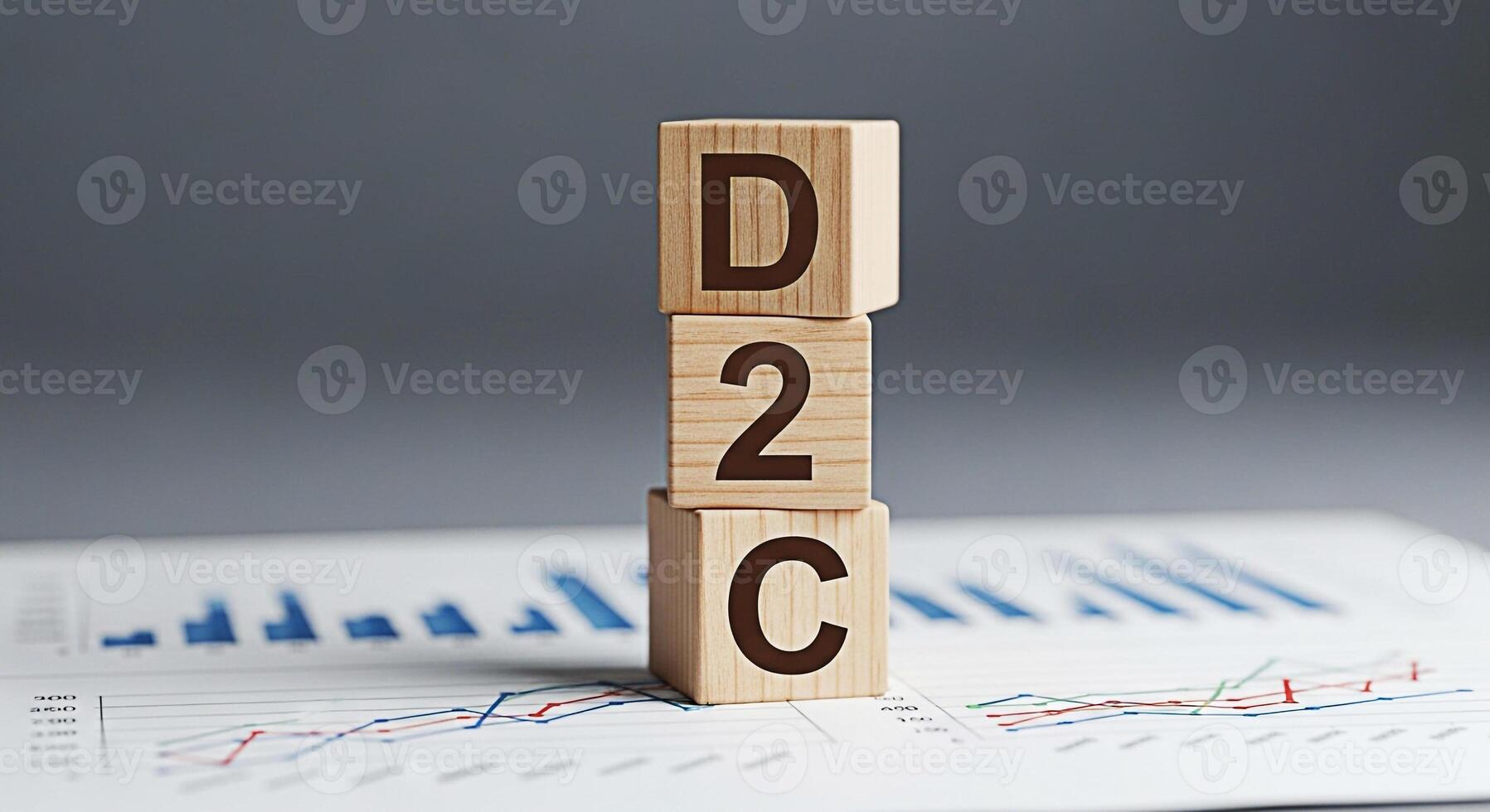 Wooden blocks spelling D2C placed on a financial report in a corporate setting representing direct to consumer business model and strategy for growth and success in the modern marketplace photo