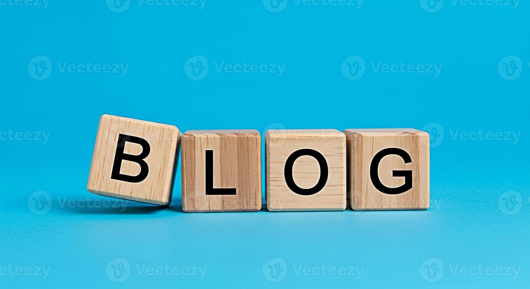 Wooden blocks spelling BLOG on a vibrant blue background representing online content creation and sharing ideas fostering a creative and informative atmosphere for digital communication photo