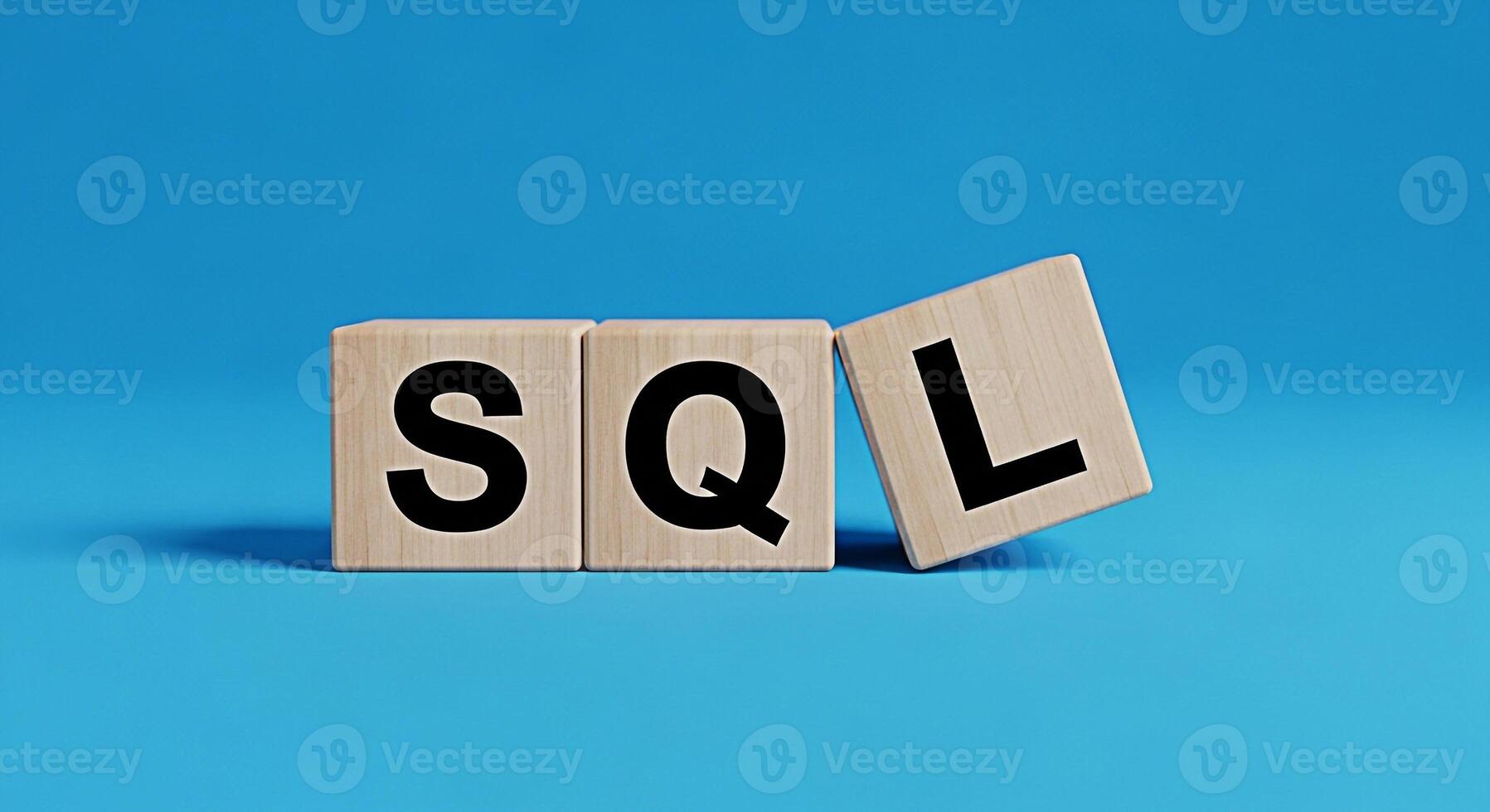 Wooden blocks displaying SQL on a vibrant blue background representing database management and query language concepts in a clean and modern studio setting ideal for technology and education visuals photo