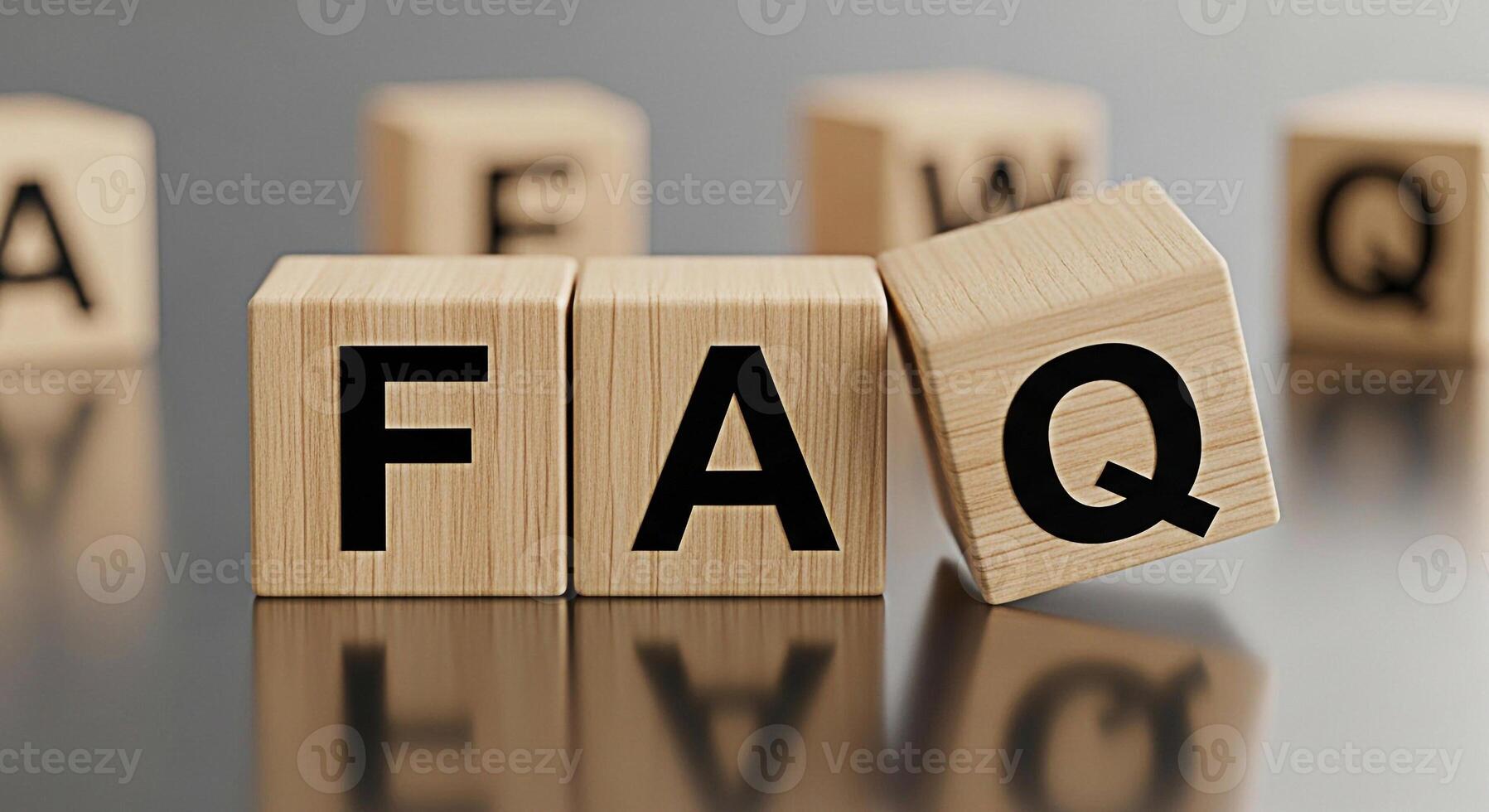 Wooden blocks spelling FAQ on a reflective surface representing frequently asked questions and information seeking in a clear and concise manner conveying a sense of knowledge and support photo