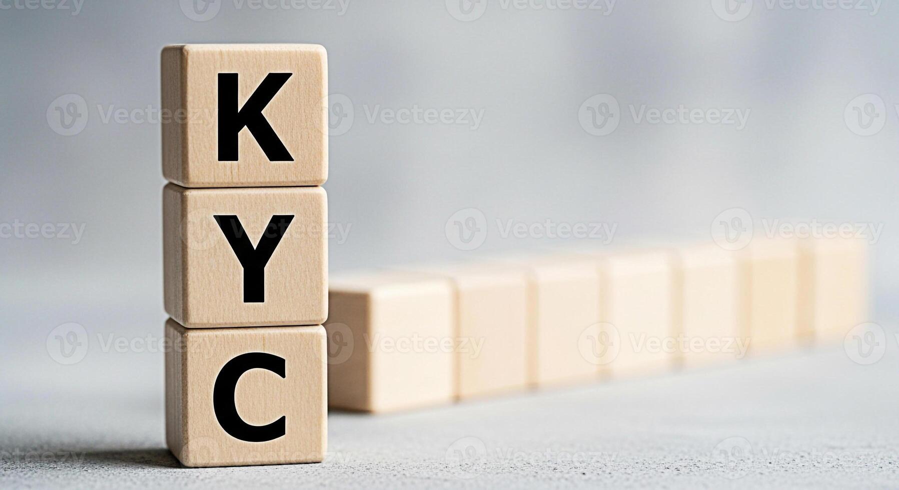 Wooden blocks displaying KYC acronym in a bright studio setting representing the importance of Know Your Customer compliance and identity verification in financial and business operations photo